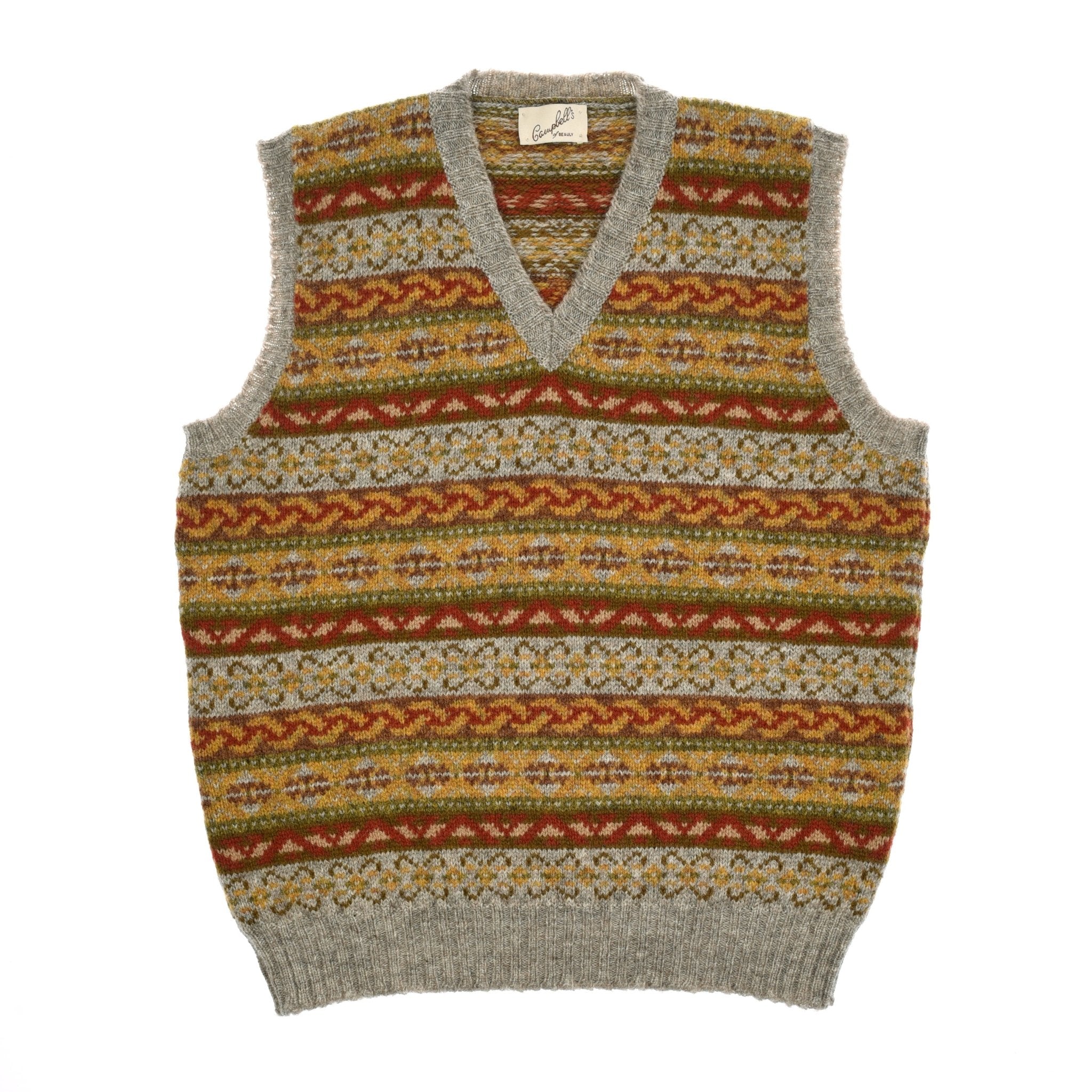 The Campbells of Beauly Fairisle Slipover is a taupe Fairisle sleeveless sweater vest, knitted from soft Shetland wool with a traditional V-neck and classic multicolor pattern.