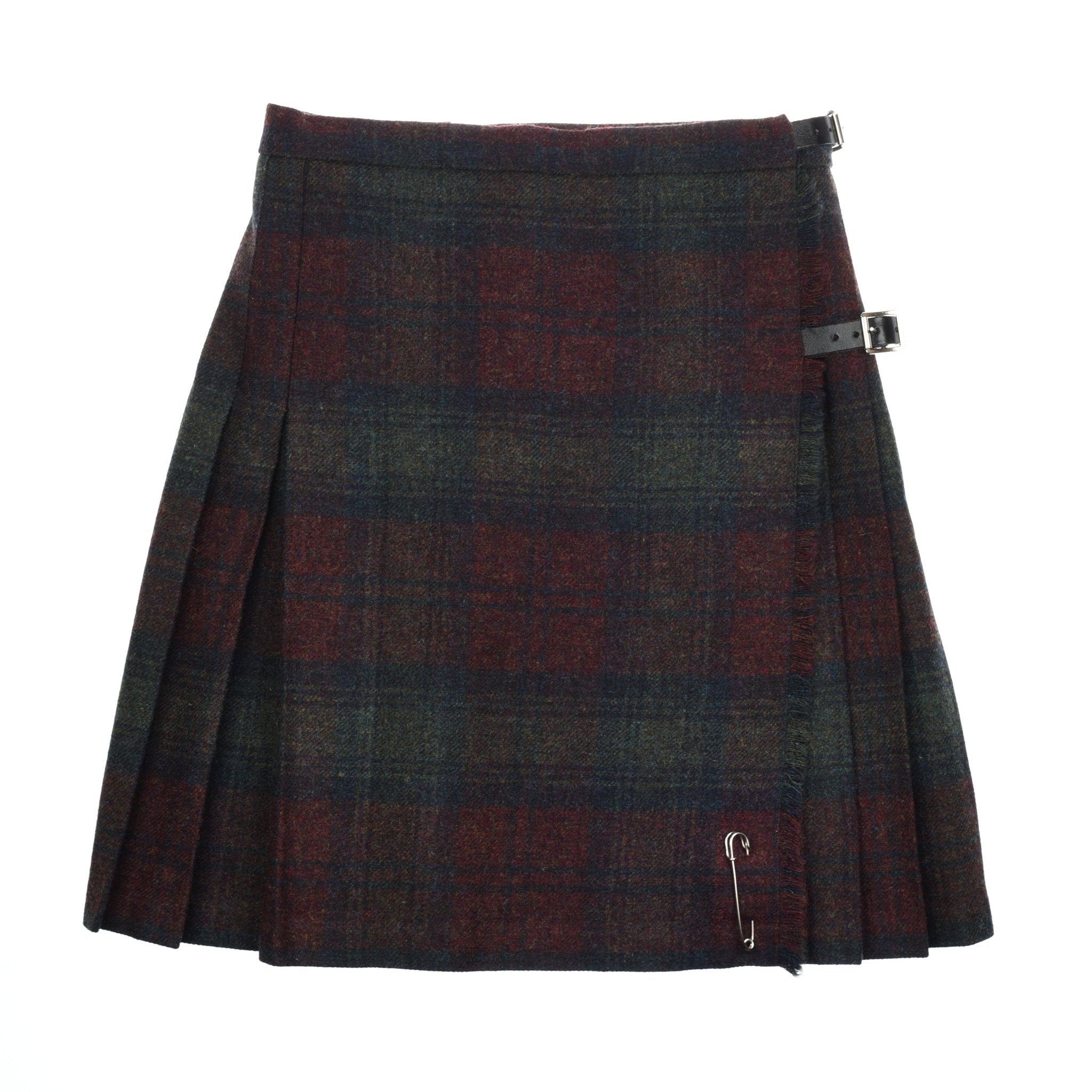 The Tweed Kilt by Campbells of Beauly features a knee-length, Lindsay Tweed-inspired red, green, and blue plaid with side pleats, two black buckle straps at the waist, and a statement safety pin for versatile styling.