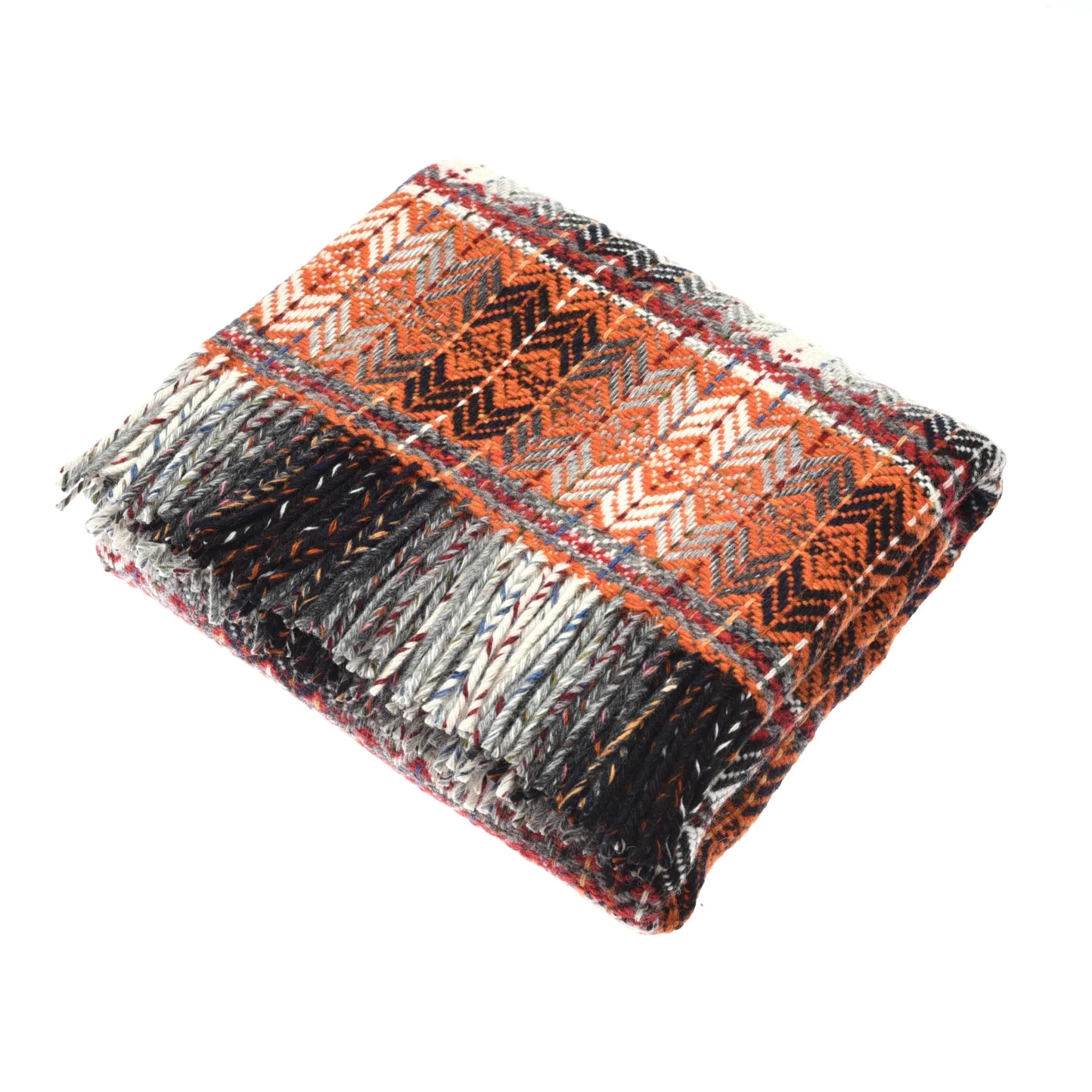 The Auld Stock Wyvis Lambswool Throw by Campbell's of Beauly features orange, black, white, and red zigzag and stripe patterns on thick, textured fabric with fringed edges, resembling an Irish woven throw.