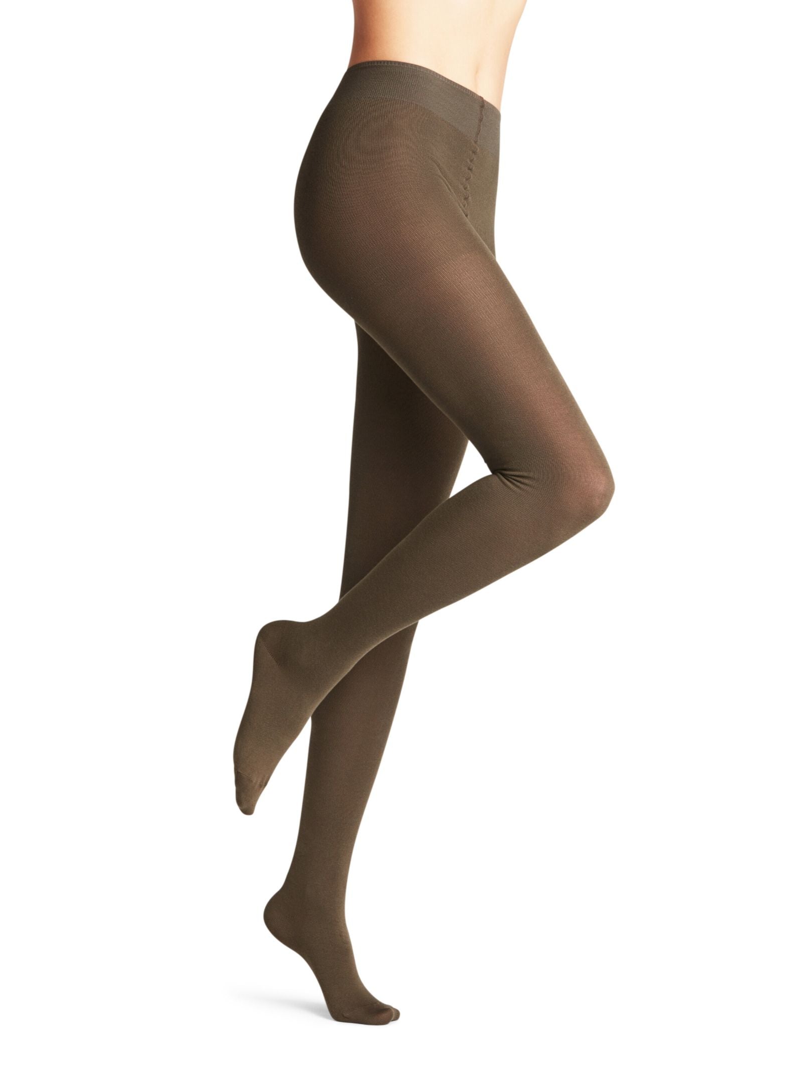 Wearing opaque, brown FALKE Cotton Tights, a person stands on one leg with the other slightly bent and raised against a plain white background; only the legs are visible.
