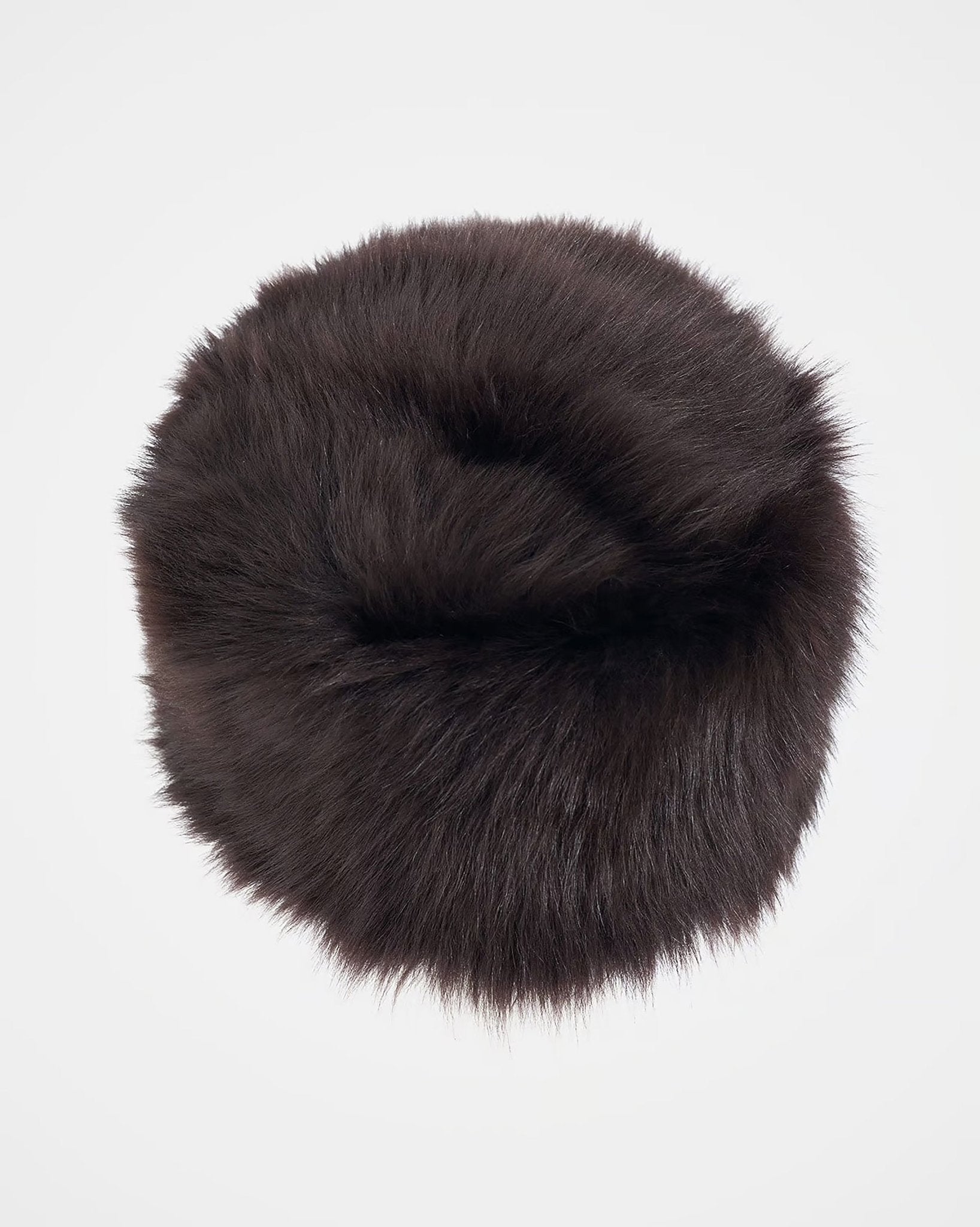 The Campbells of Beauly Pillar Box Hat is a round, dark brown Toscana sheepskin fur hat with a soft, fluffy texture and great insulation, displayed on a plain white background.