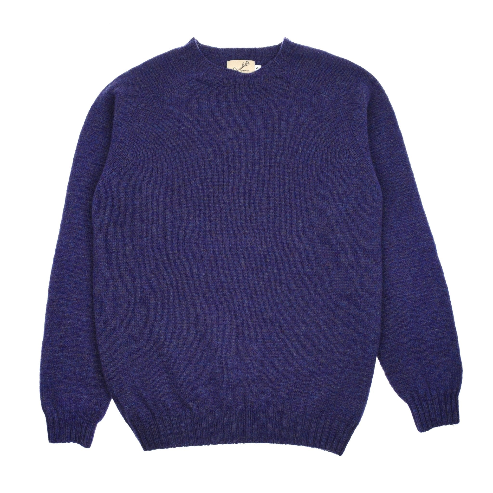 A plain, long-sleeved Shetland Jumper by Campbells of Beauly in Heather, crafted from soft lambswool yarns with ribbed cuffs, collar, and hem, is laid flat on a white background.