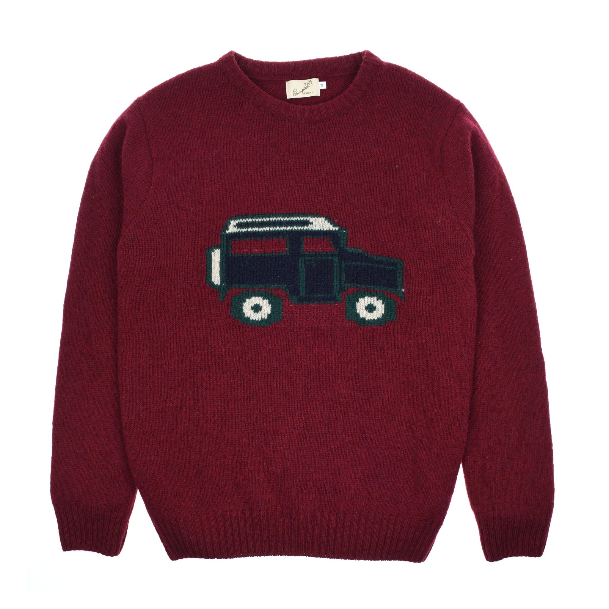 The Campbells of Beauly Land Rover Defender Jumper is a burgundy knit sweater featuring a dark green and black car graphic inspired by the classic Land Rover Defender design.