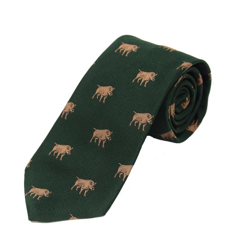 The Boar Silk Tie by Campbells of Beauly is a dark green handmade silk necktie featuring a repeating light brown boar pattern, with its countryside motif clearly visible on the neatly rolled tip.
