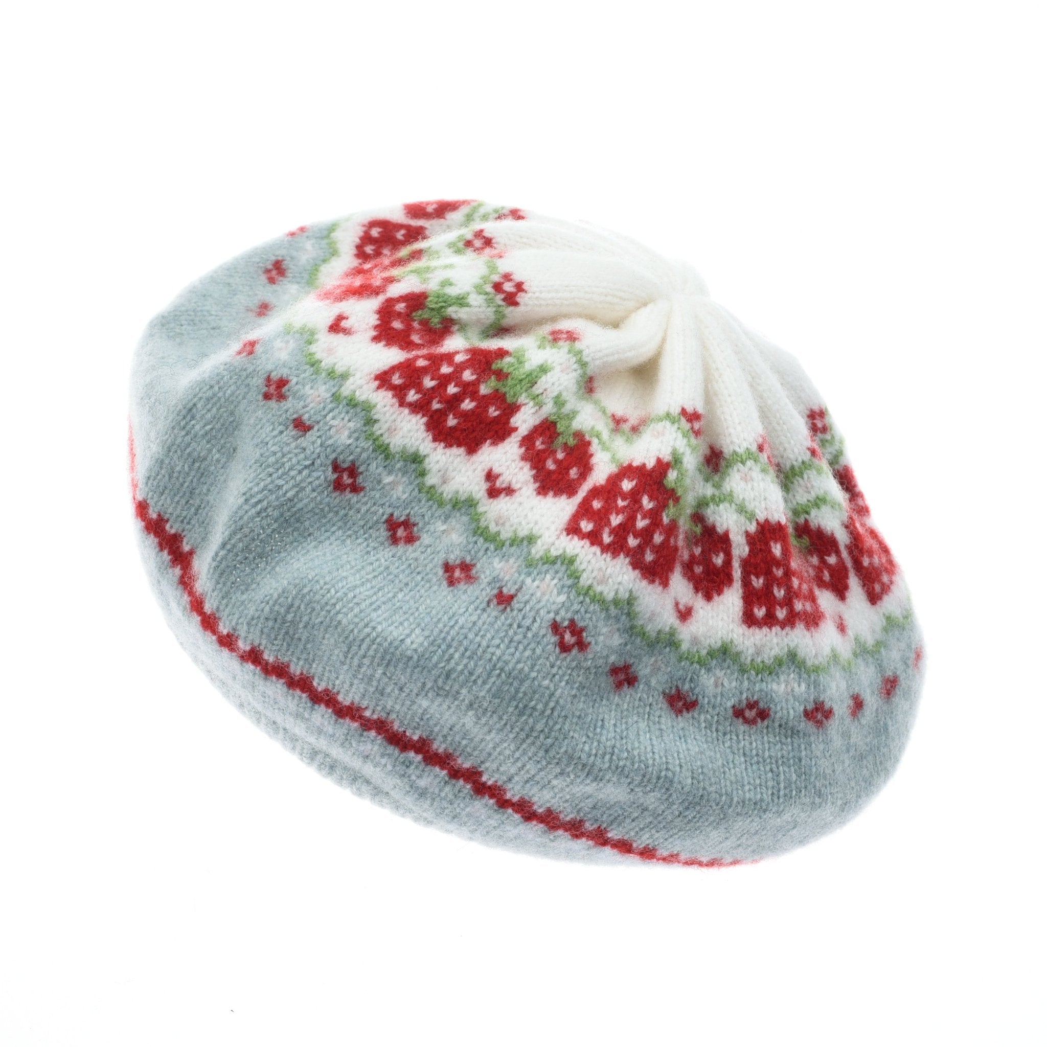 The Strawberry Beret by Campbells of Beauly features a Skye blue base, white top, and a strawberry-inspired design with red strawberries, green leaves, and vibrant geometric patterns.