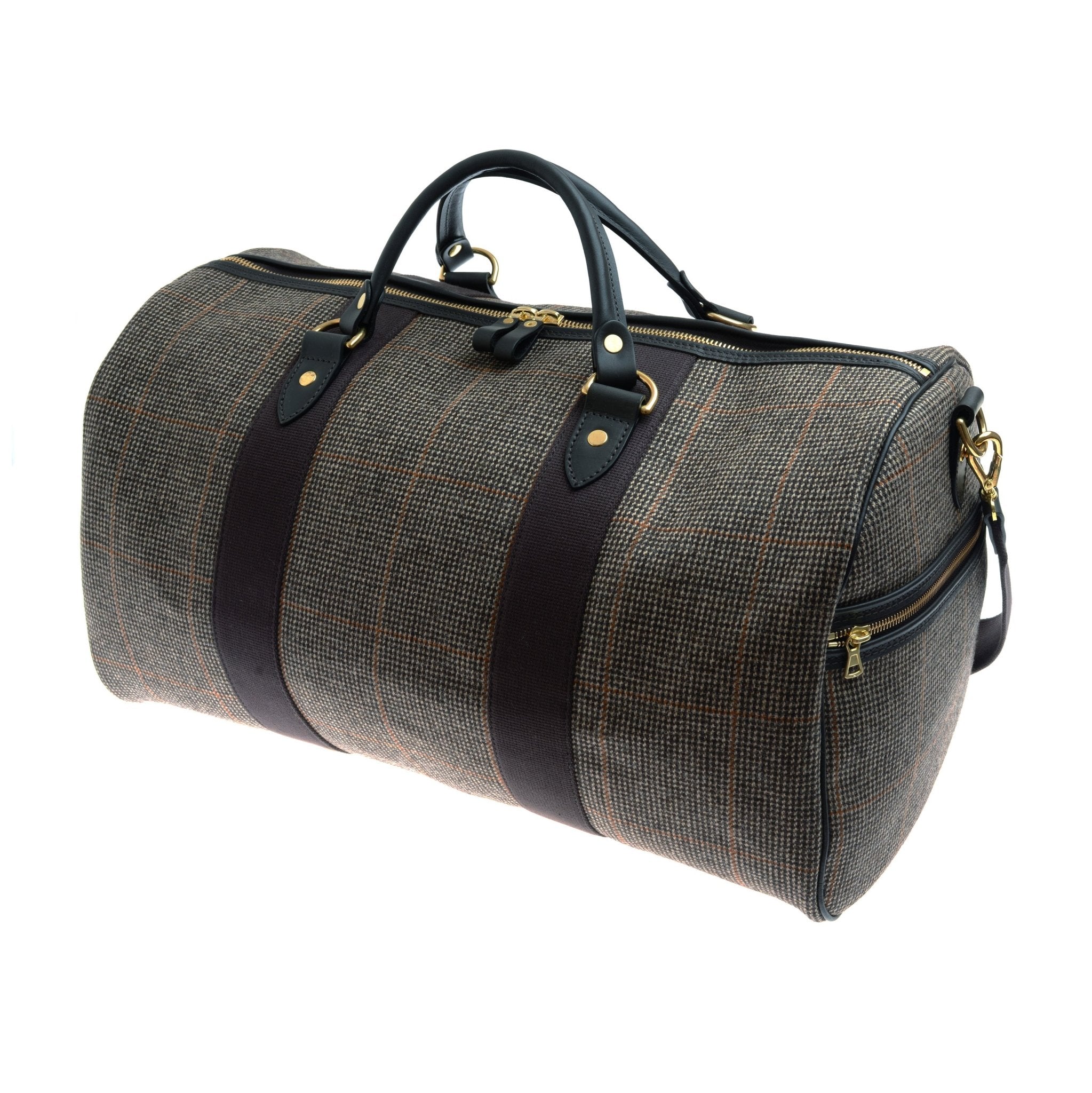 The Campbells of Beauly Hand Luggage Holdall features brown plaid, black leather handles, gold hardware, zip closure, two dark vertical stripes, a zippered side pocket, and durable bridle leather straps.