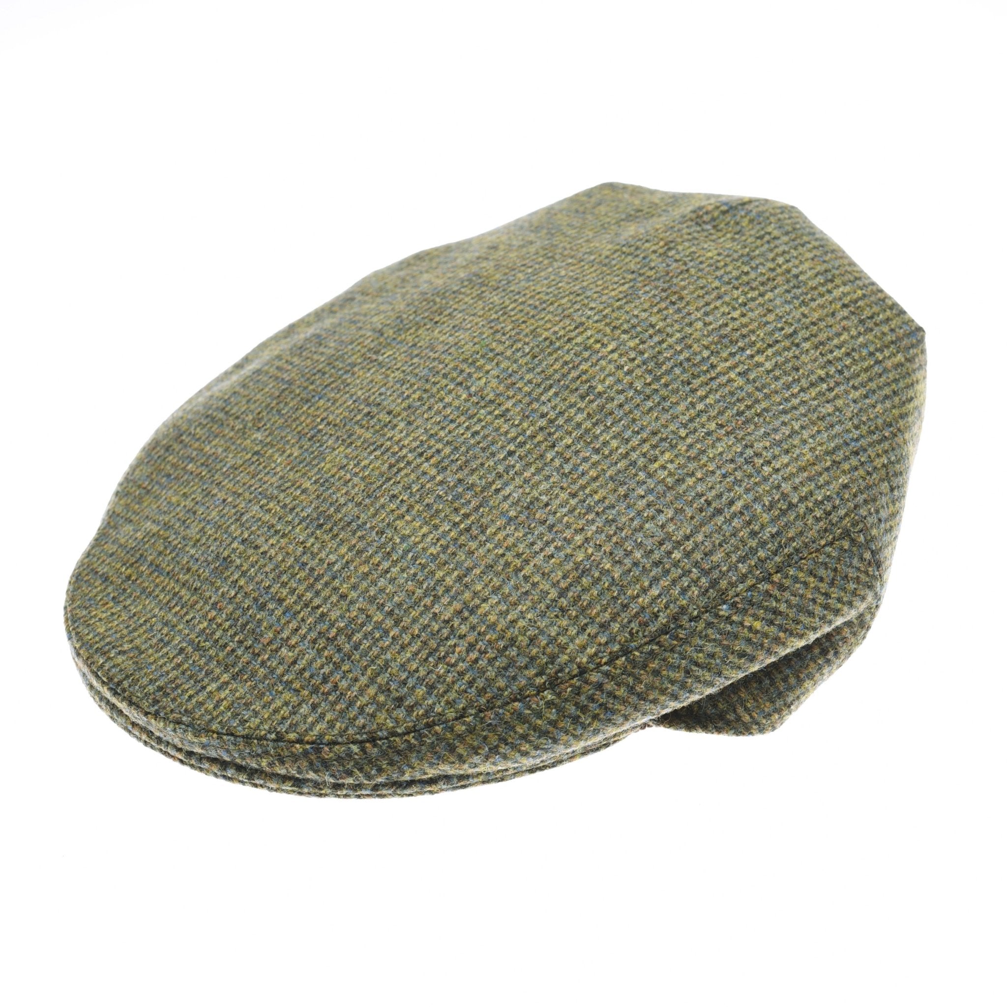 The Green Conon Cap by Campbells of Beauly, in color C24, is a classic flat cap with green and brown British tweed, a rounded shape, and short brim, shown against a white background.