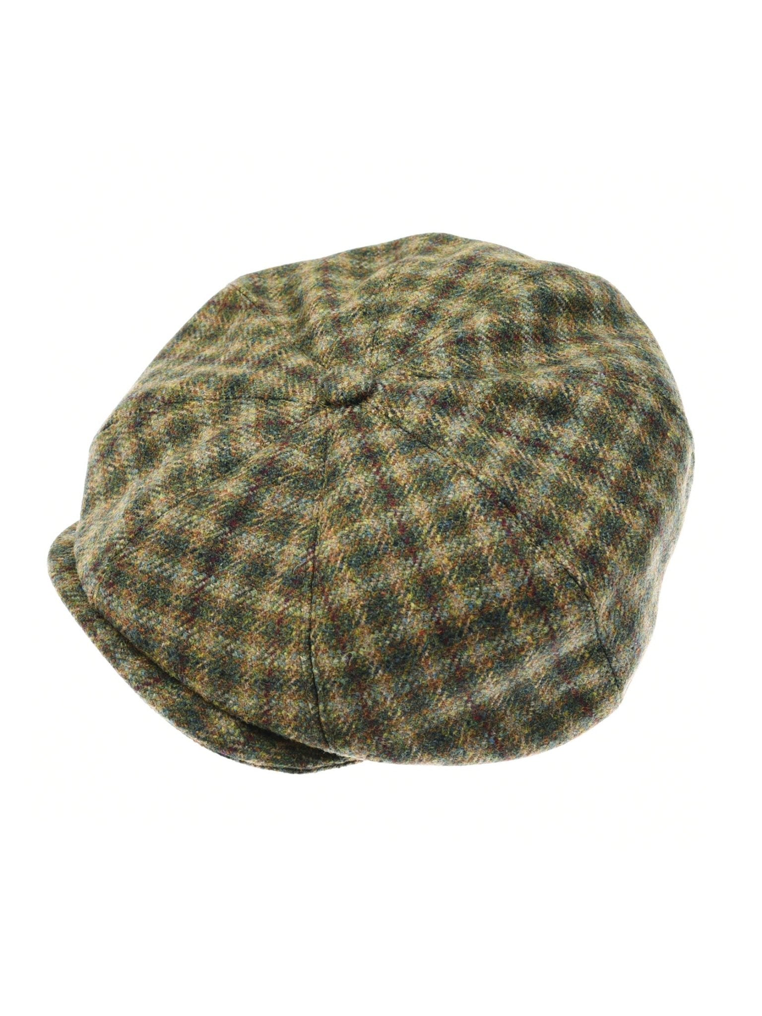 The Farrar Cap by Campbells of Beauly features green, brown, and beige plaid with a rounded crown and short brim, inspired by British country heritage and shown on a white background.