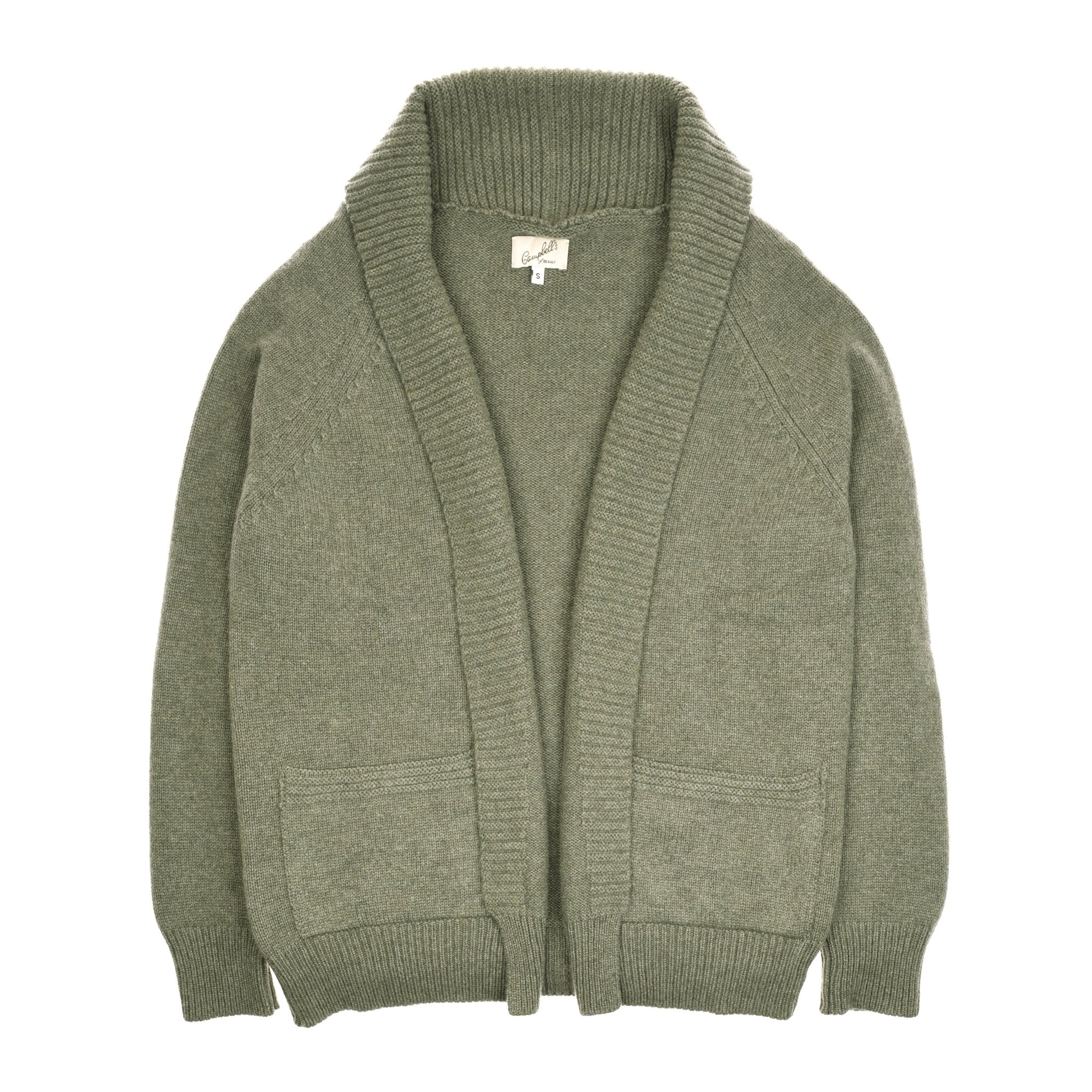 The Campbells of Beauly Cashmere Shawl Cardigan in sage green features a chunky knit, wide ribbed shawl collar, open front, long sleeves, two patch pockets, and ribbed cuffs and hem. Displayed flat on a white background.