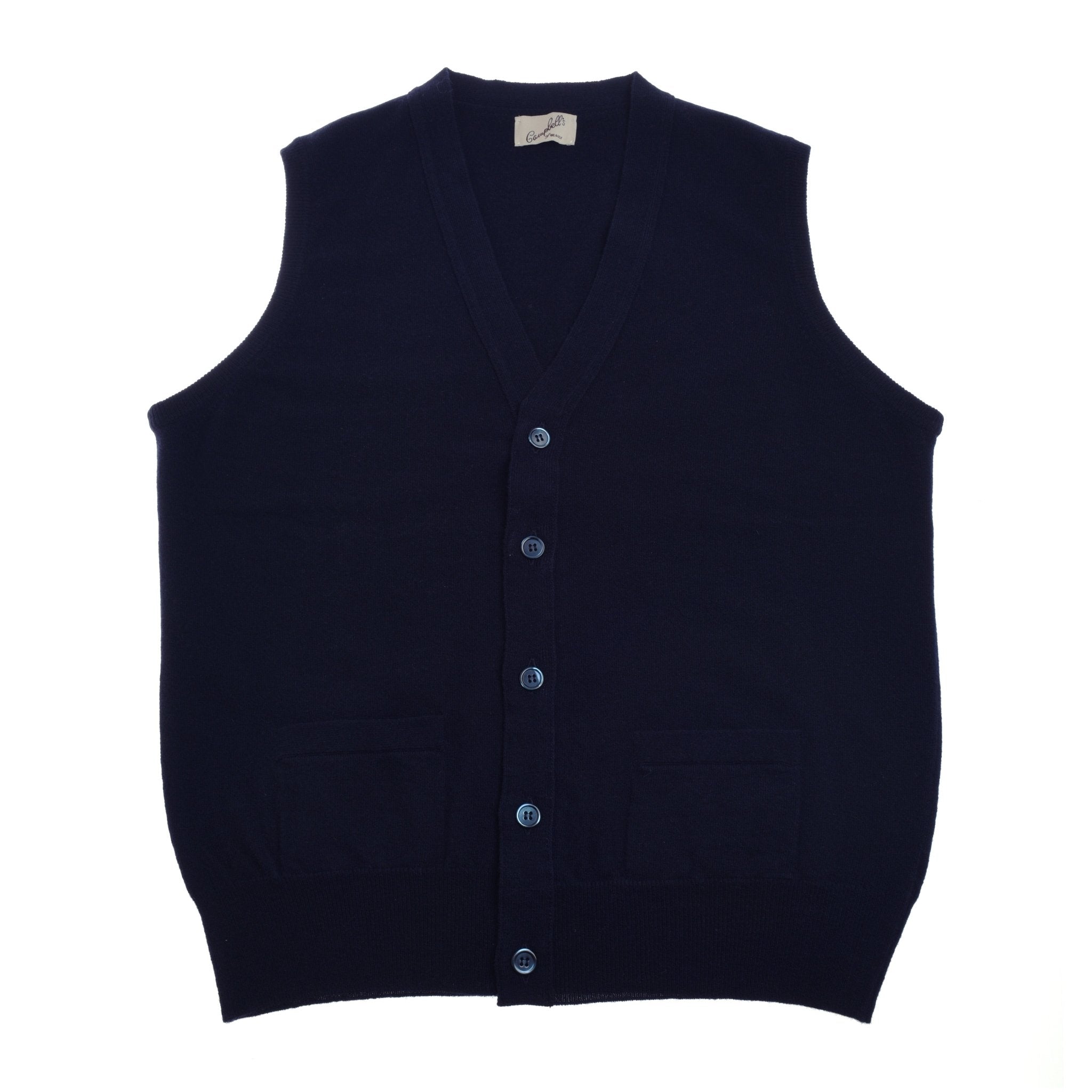 The Geelong Lambswool Button Waistcoat by Campbells of Beauly is a sleeveless, dark navy blue waistcoat made from fine lambswool, with two front pockets—an elegant addition to any country wardrobe. Shown flat on a white background.