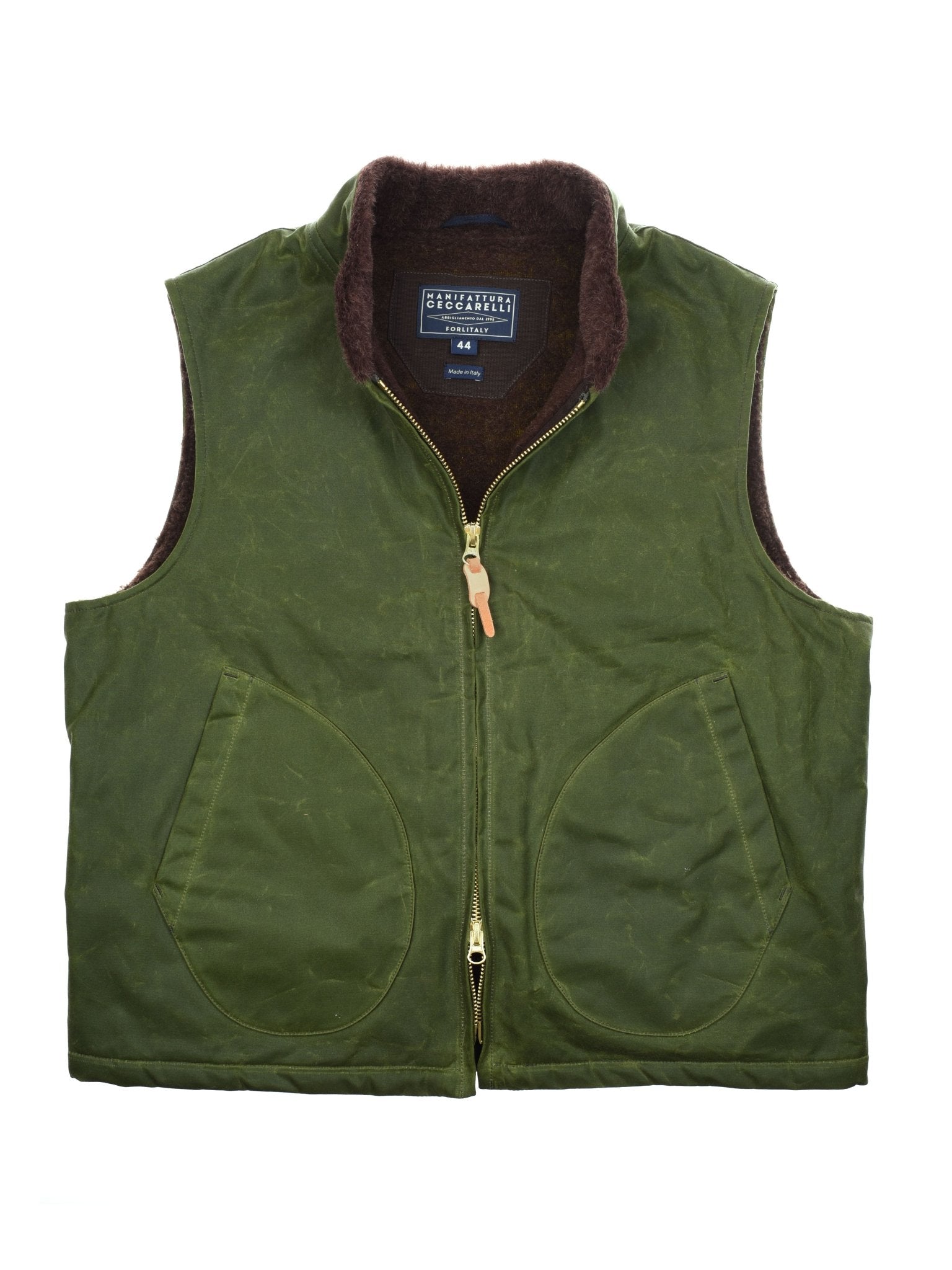 The Wax Nehru Gilet by Campbell's of Beauly features a green zip-up design, brown fleece-lined Nehru collar, large curved front pockets, and an inner “44L” fabric tag, offering a rugged, outdoorsy look.