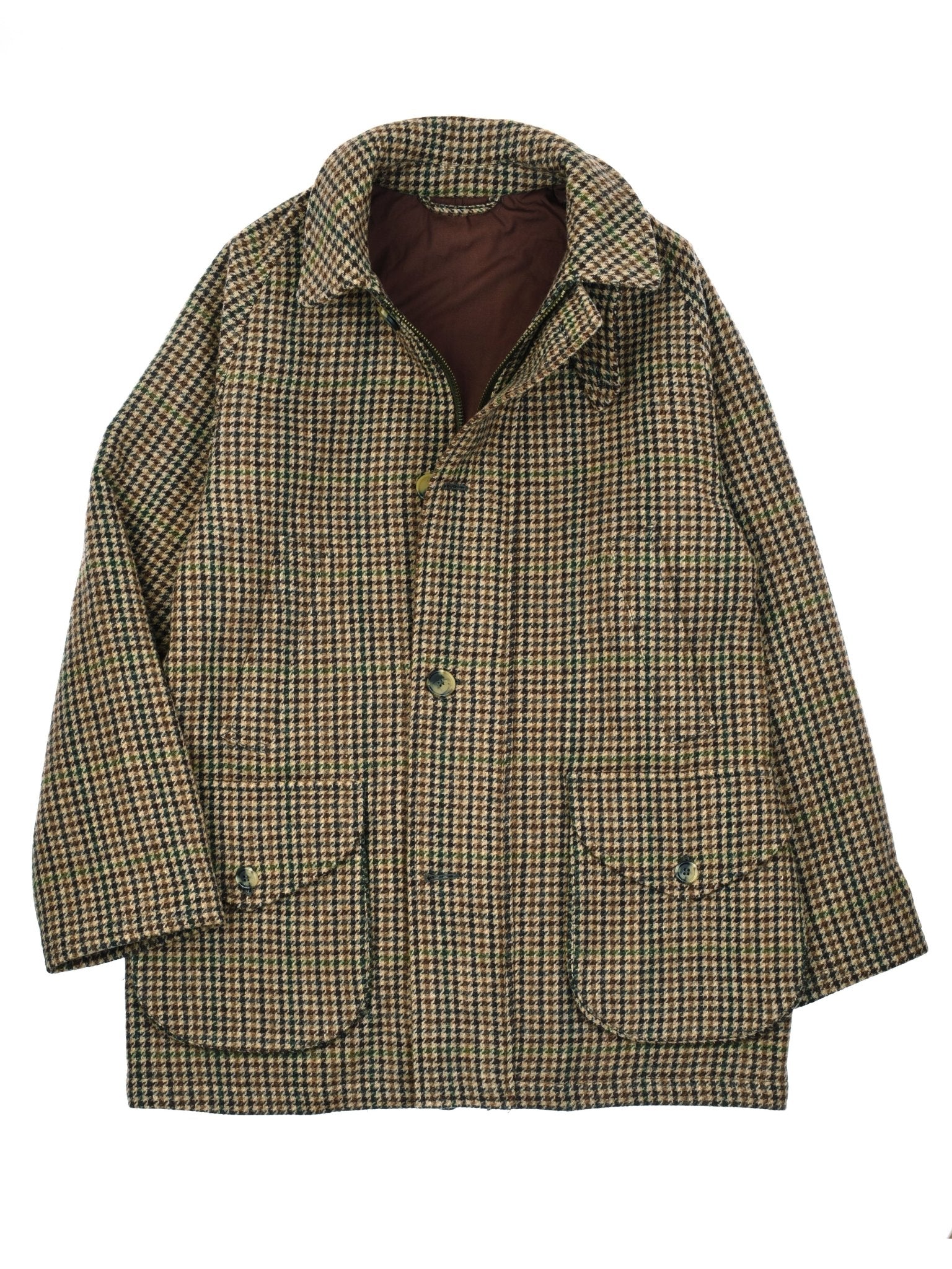 The Cannich Coat by Campbells of Beauly features a brown and green houndstooth pattern, collar, button front, and large flap pockets—ideal for country pursuits. Shown laid flat on a white background.
