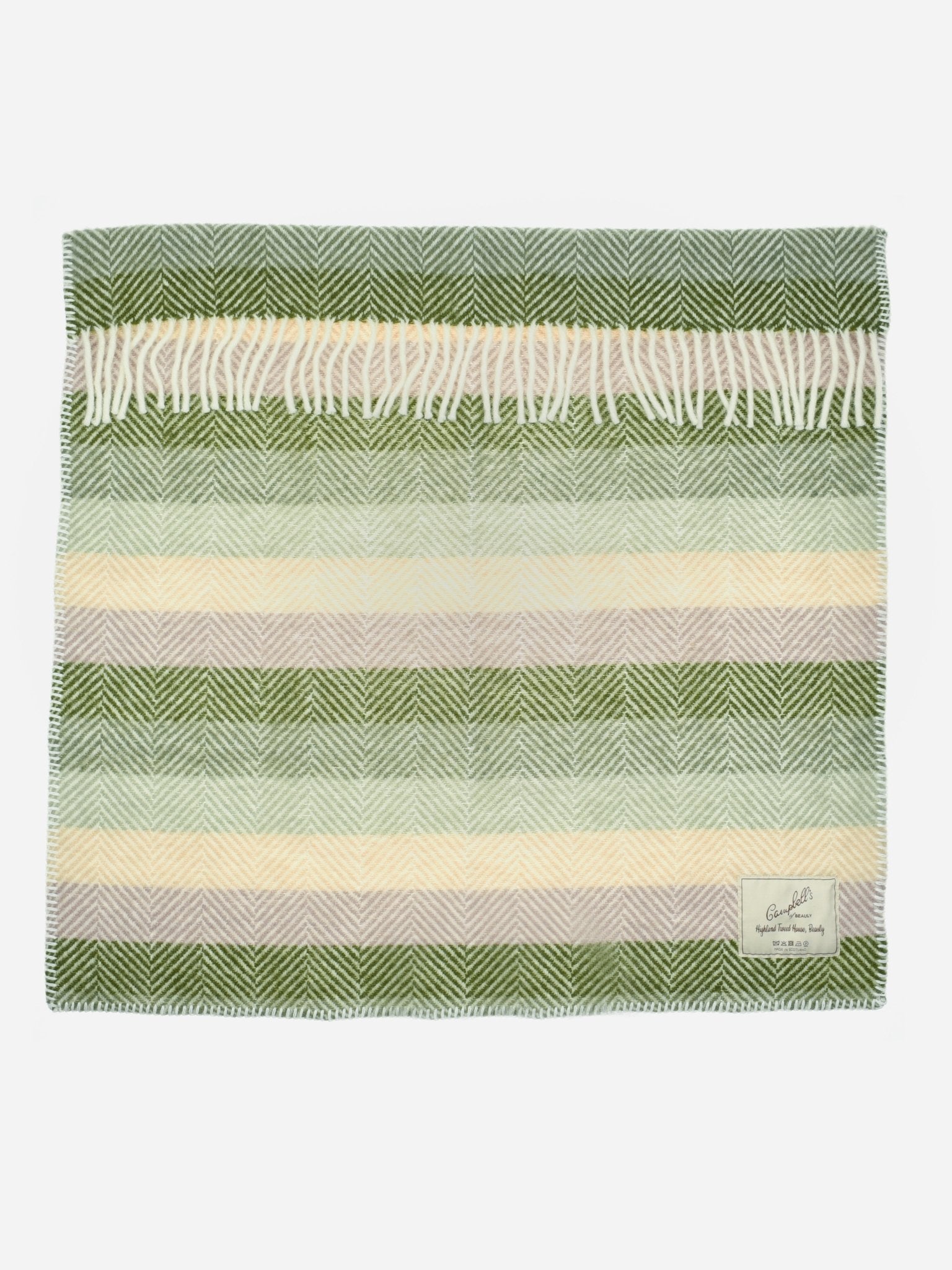The Campbells of Beauly Baby Blanket in Soft Green Stripe features a soft wool weave with a herringbone pattern, cream and beige stripes, fringed edges, and a branded label—designed for year-round comfort in your pram.