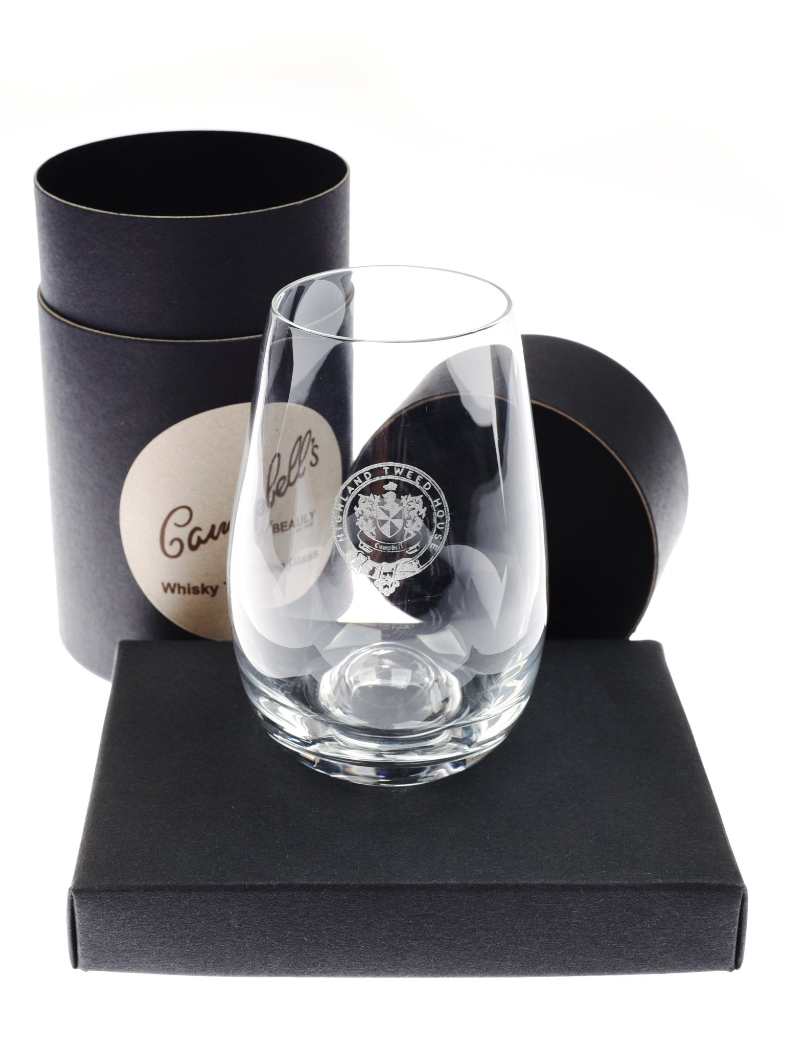 The Campbells of Beauly Whisky Tasting Glass features a clear, tulip shape and etched emblem. Presented on a black box with its branded cylindrical container, its ideal for whisky enthusiasts seeking an elevated tasting experience.
