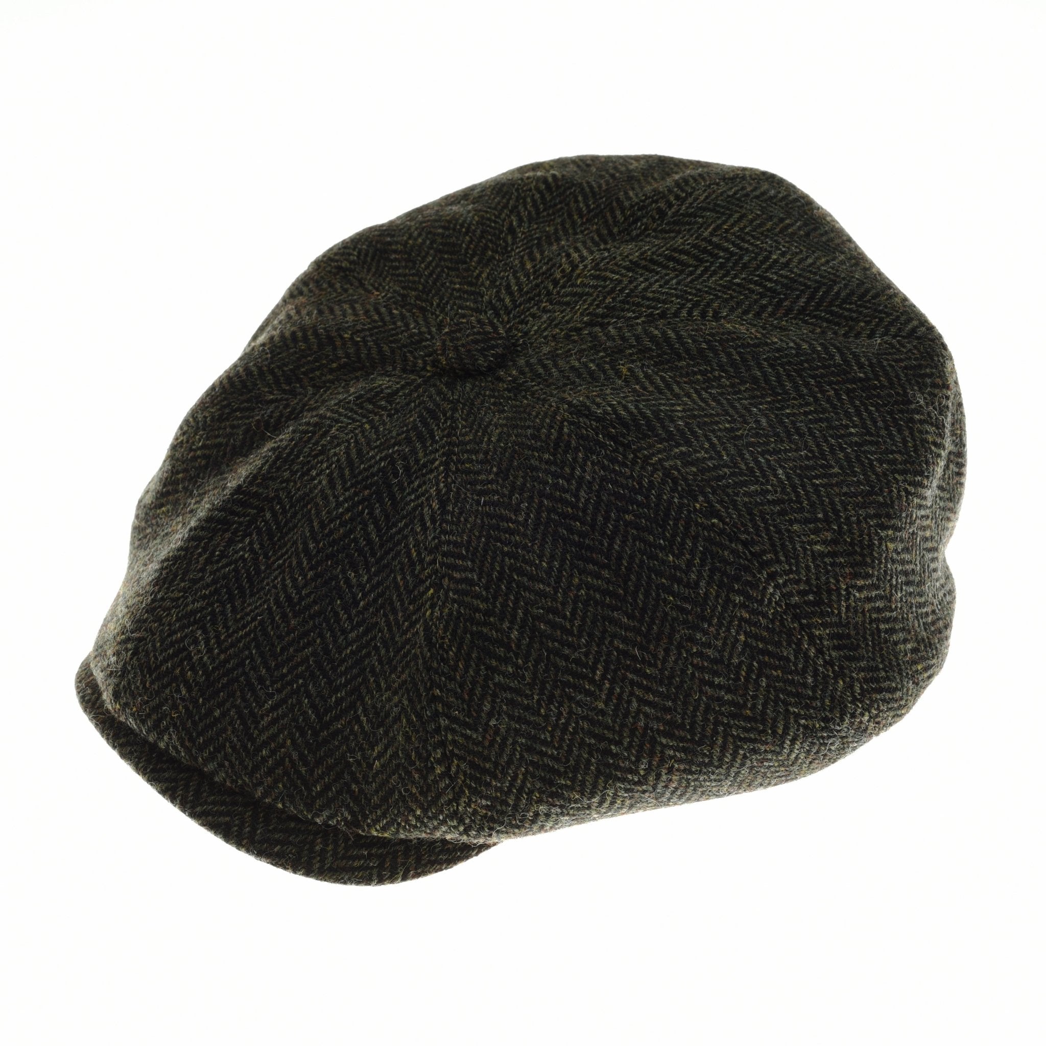 The Farrar Cap by Campbell’s of Beauly features a green herringbone pattern inspired by British country heritage and traditional 8-piece caps, shown against a plain white background.