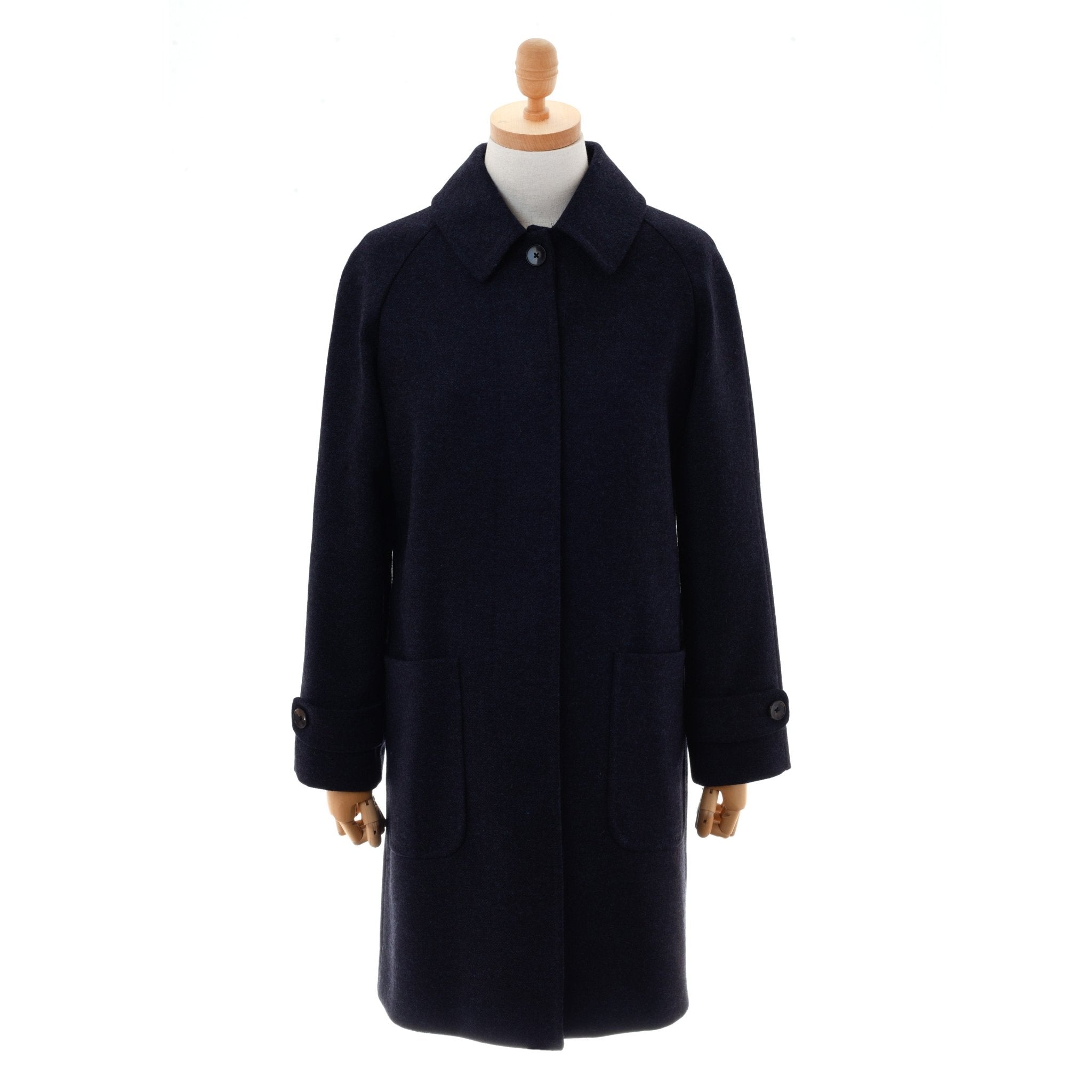The Midnight Collar Coat by Campbells of Beauly features a collar, buttoned cuffs, and large front pockets. Shown in midnight color with classic tailoring on a mannequin against a white background.
