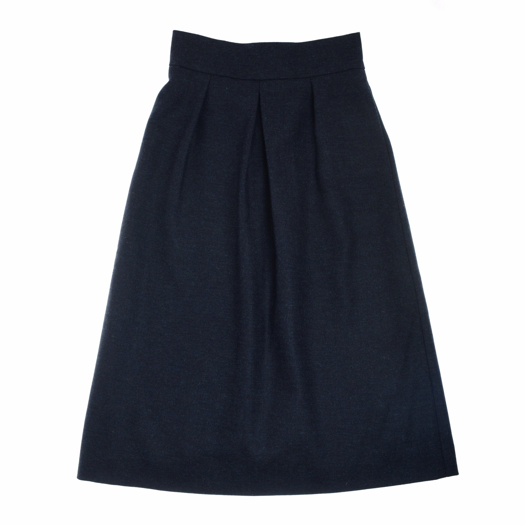 The Campbells of Beauly Bell Skirt is a high-waisted, knee-length A-line skirt in dark navy with front pleats and a subtle bell shape, made from medium-weight fabric and shown flat on a white background.