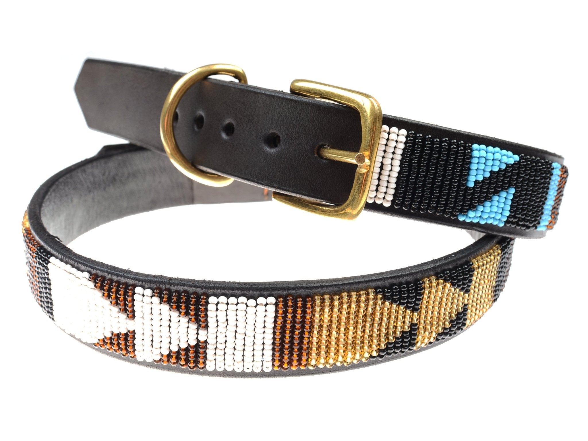 The Campbells of Beauly Dog Collar is black leather with a brass buckle and D-ring, handcrafted by Masai women in white, gold, brown, blue, and black beads in geometric patterns.