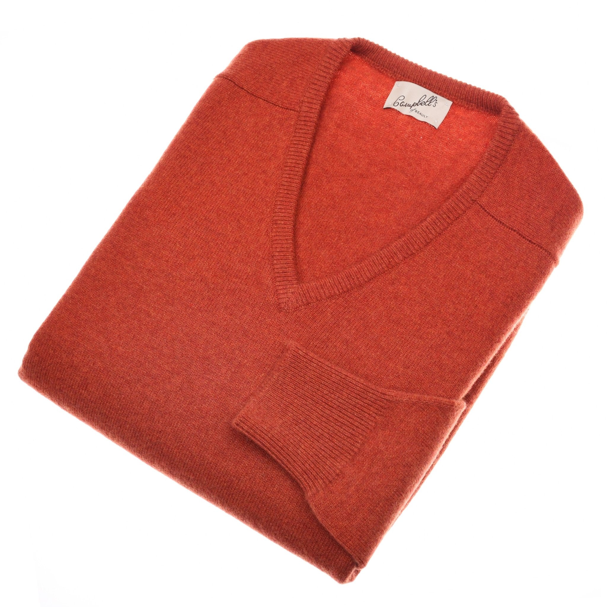 A neatly folded Campbells of Beauly Lambswool V-Neck Jumper in Ember, classic-fit with a visible collar label, displayed on a white background.