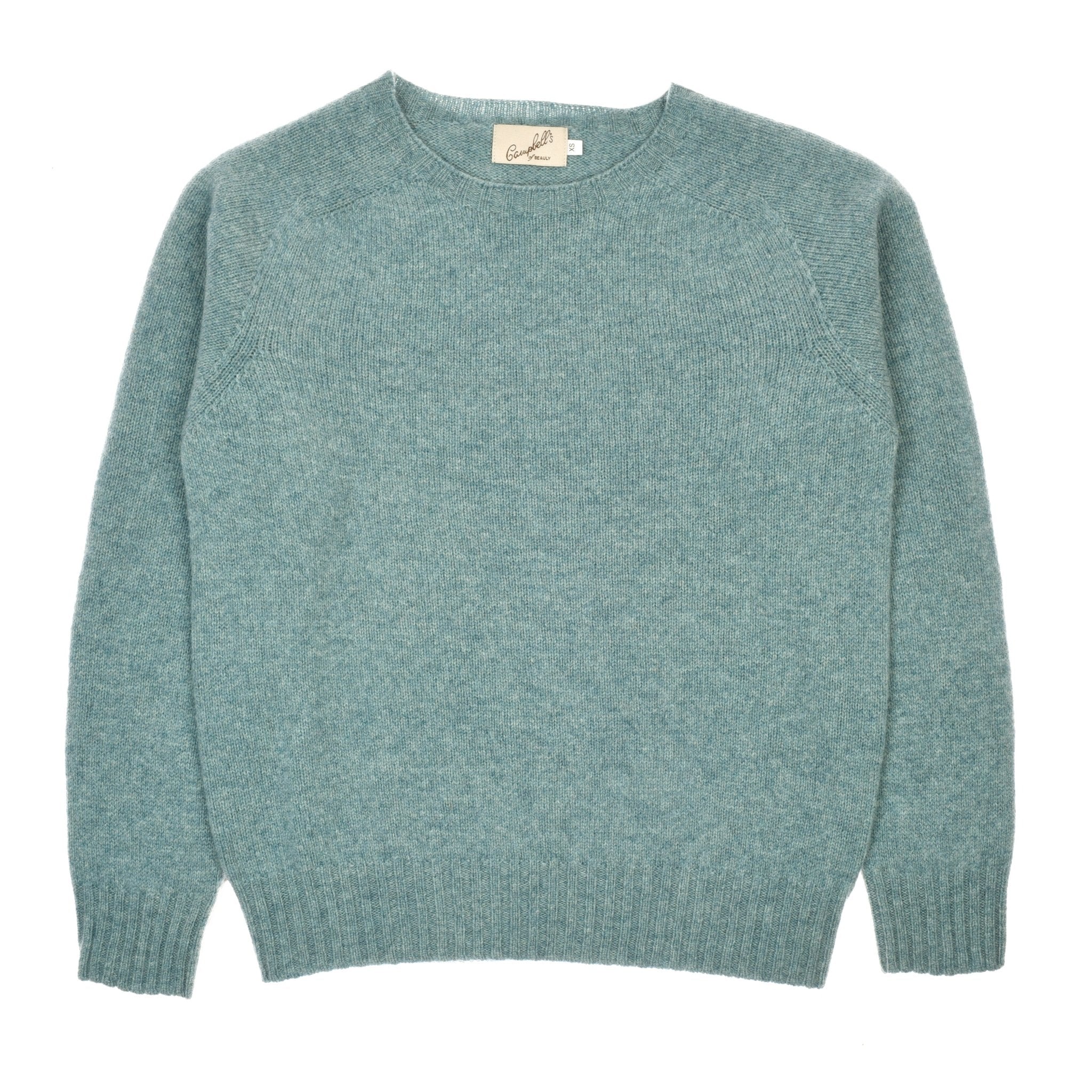 The Campbells of Beauly Geelong Lambswool Crew Neck Jumper in Seagrass features a soft knit, long sleeves, and ribbed cuffs, hem, and collar. Shown laid flat on a white background.