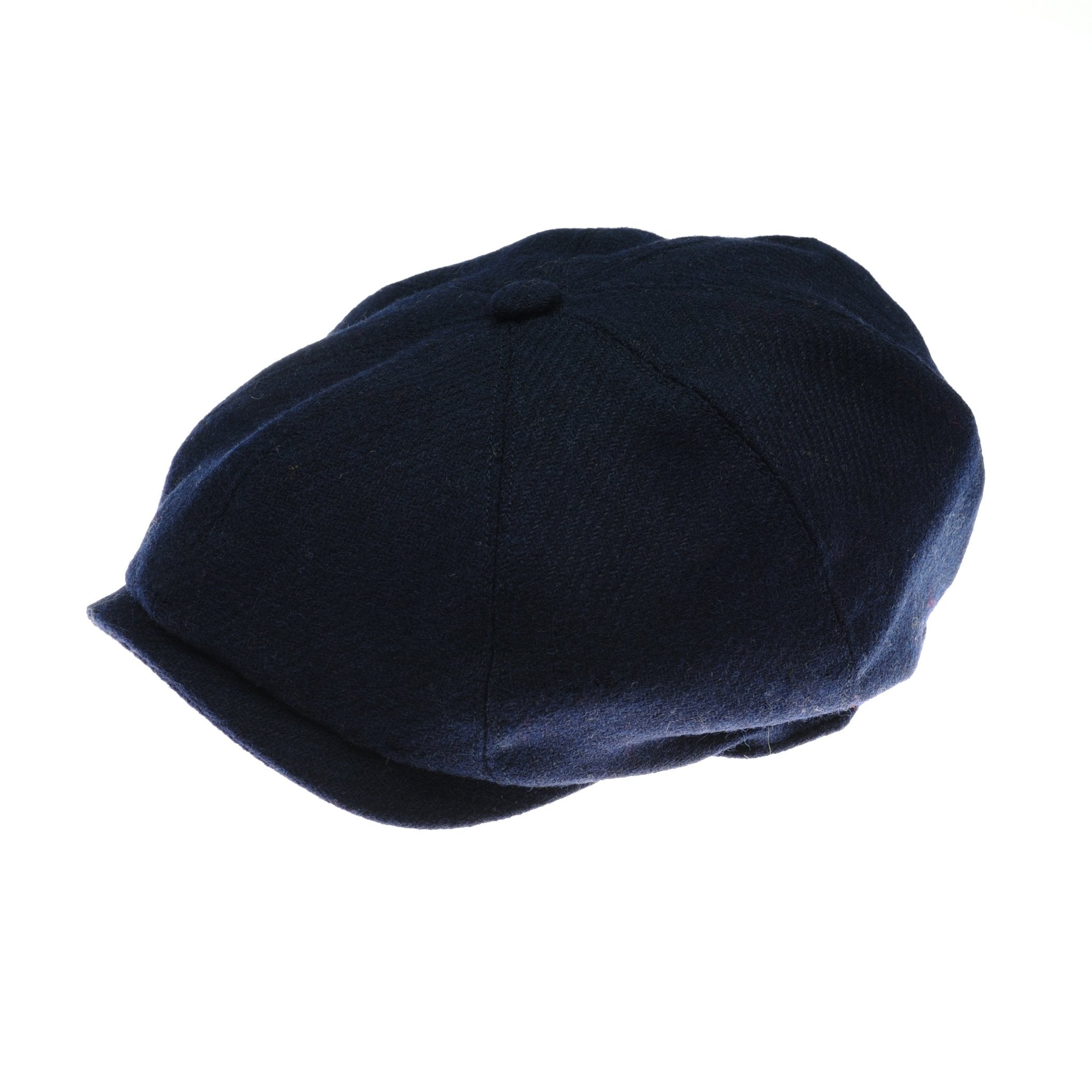 The Farrar Cap by Campbells of Beauly, crafted from textured dark blue fabric and inspired by classic British 8-piece newsboy designs, is displayed against a plain white background.
