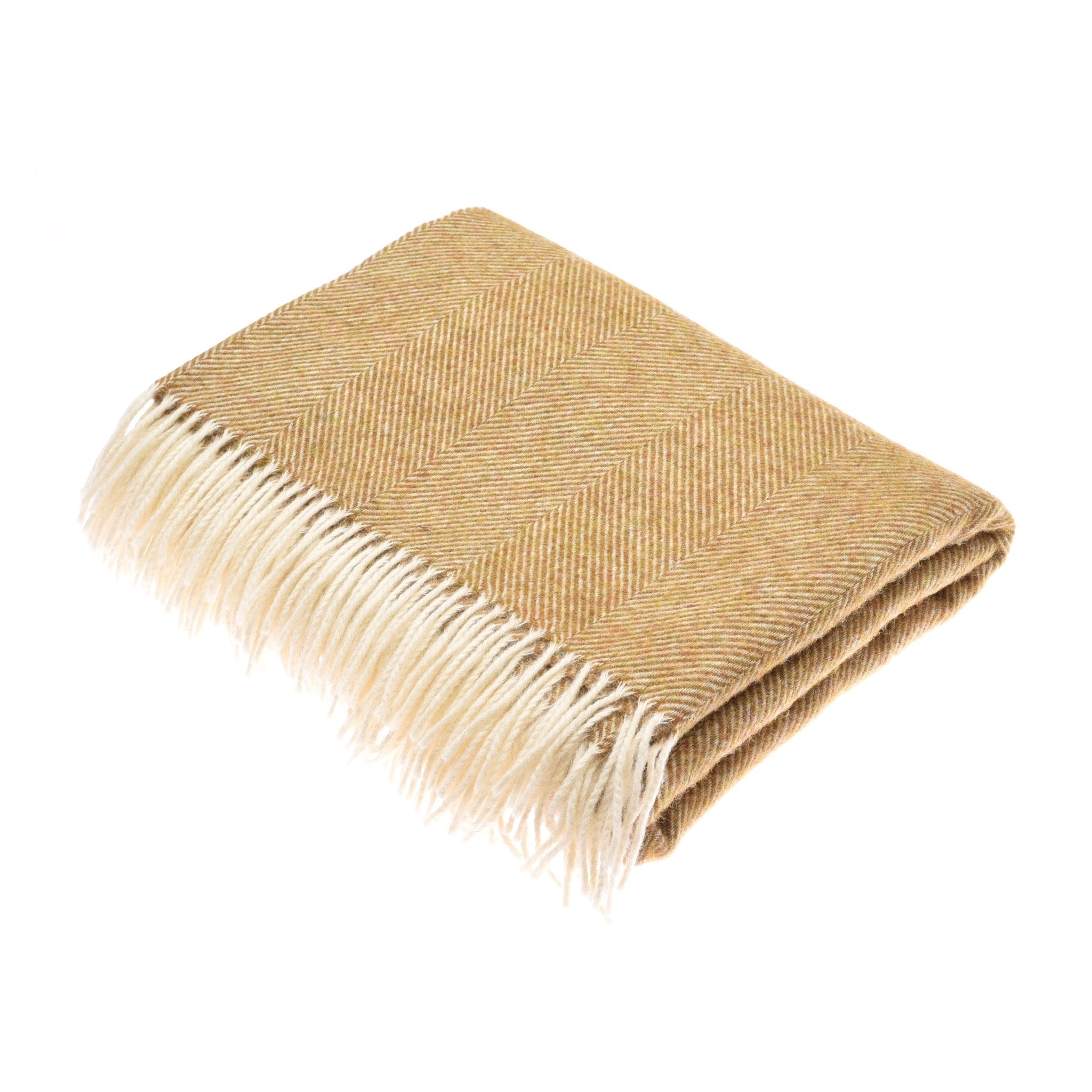The Campbells of Beauly Herringbone Lambswool Blanket in gold features a subtle herringbone pattern and white fringe on one edge, shown folded against a white background.