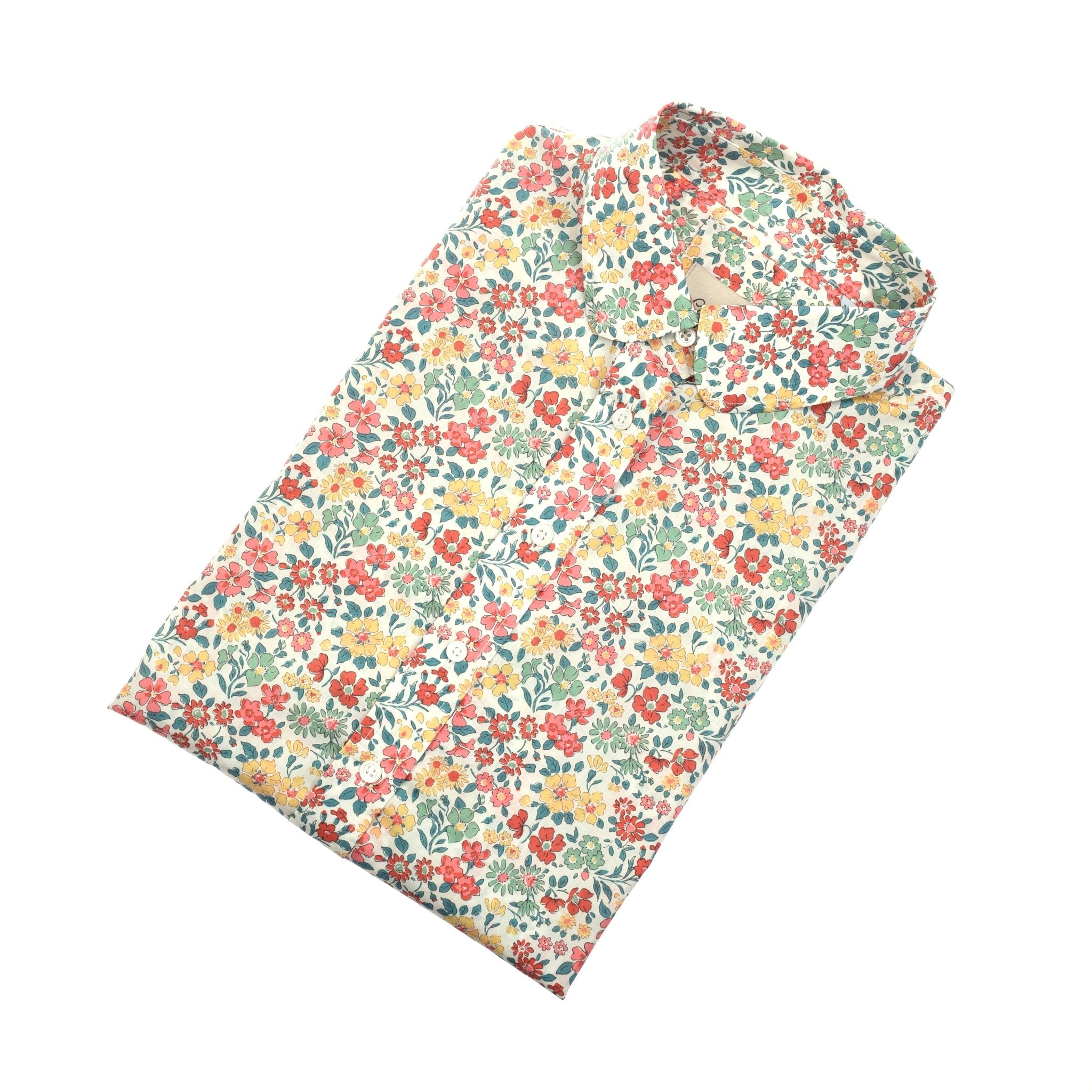 A Liberty Print Cotton Shirt by Campbells of Beauly, crafted from soft Tana Lawn cotton with a colorful red, yellow, and green floral pattern on white, neatly folded and displayed on a white surface.