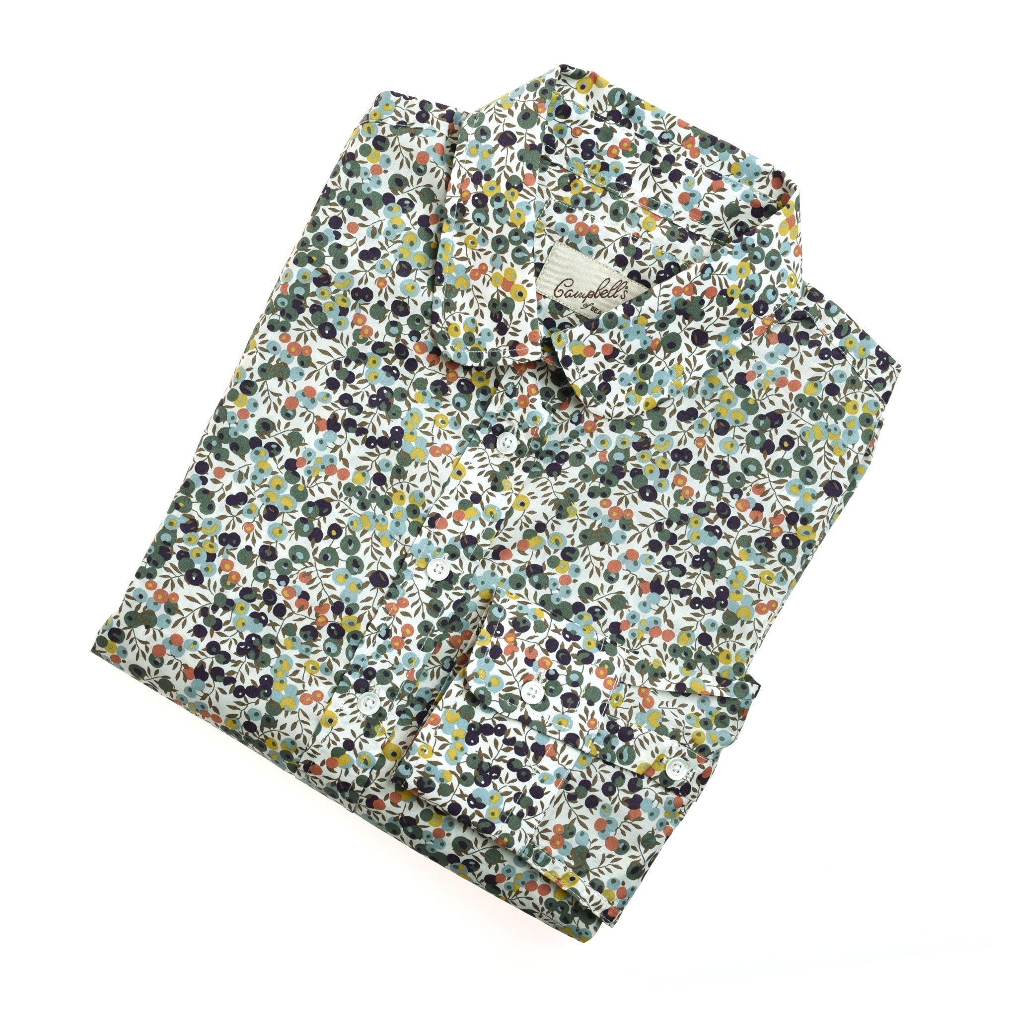 A neatly folded Campbells of Beauly Liberty Print Cotton Shirt with a vibrant floral pattern in green, orange, purple, and yellow on a white background.