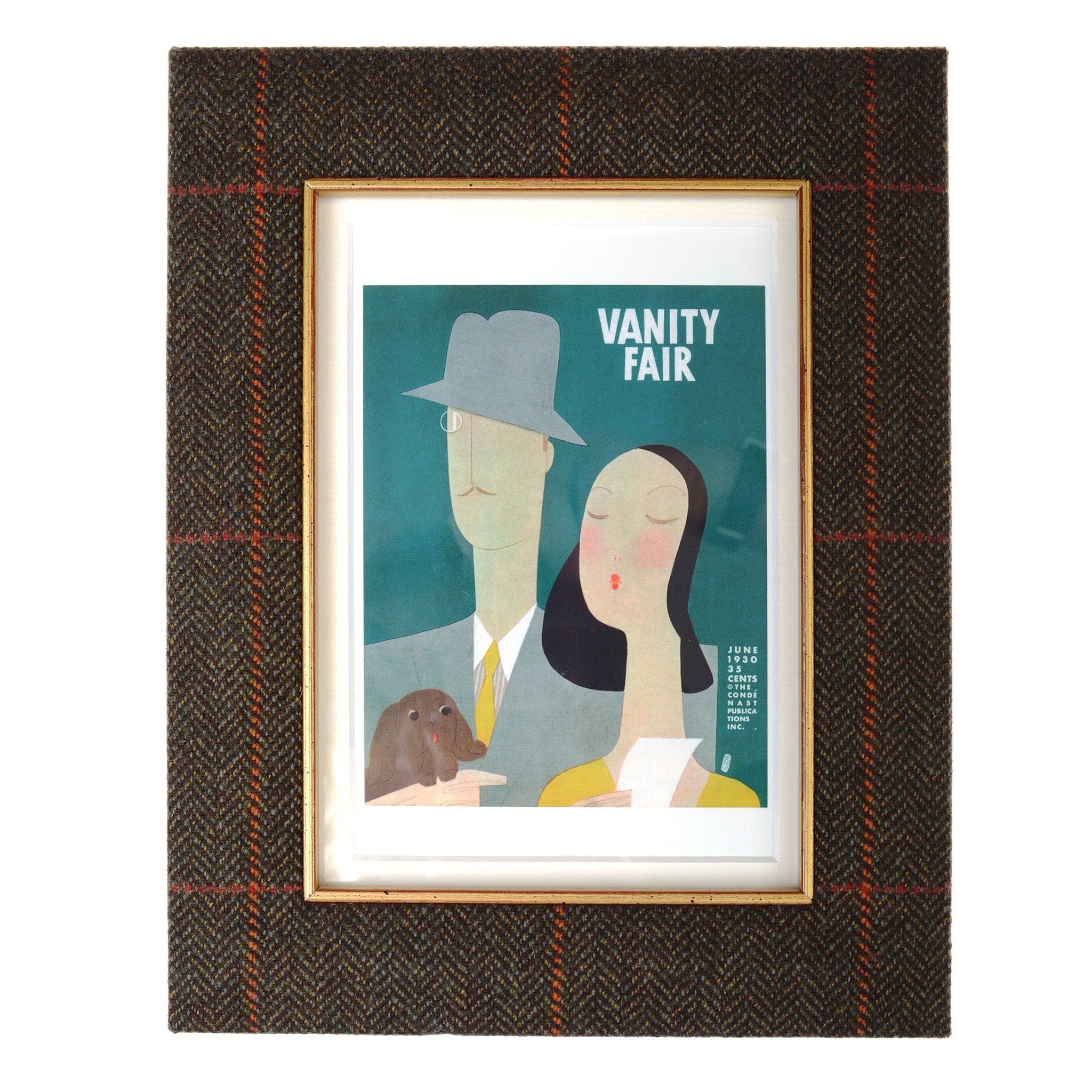 Framed Vanity Fair magazine cover illustration with a man in a suit and hat holding a dog, and a woman with black hair holding paper—ideal for displaying in the Tweed Photoframe by Campbell’s of Beauly.