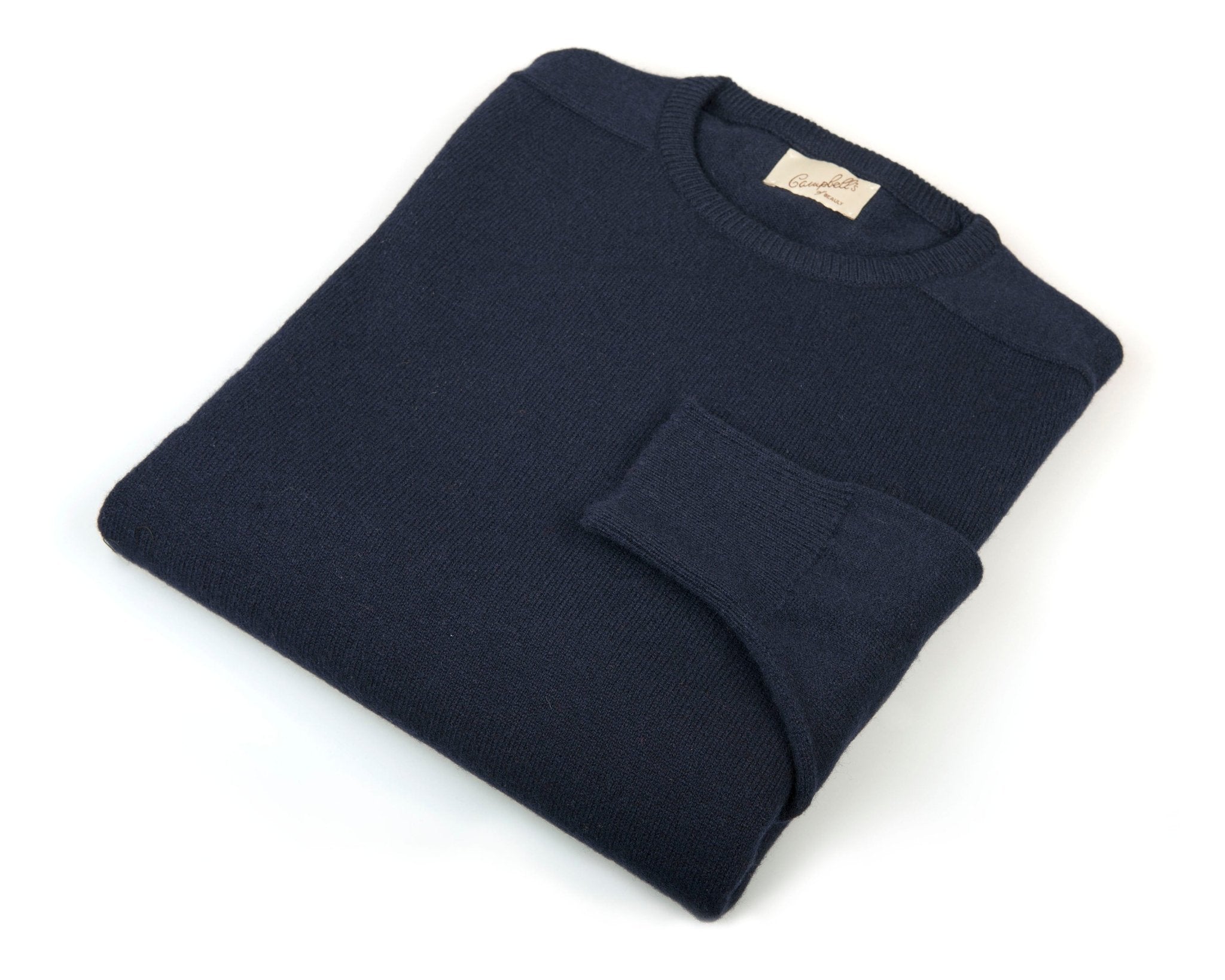 The Campbells of Beauly Lambswool Crew Neck Jumper, in dark blue, crafted from soft lambswool and inspired by the Scottish Borders heritage, is neatly folded and displayed on a white background.