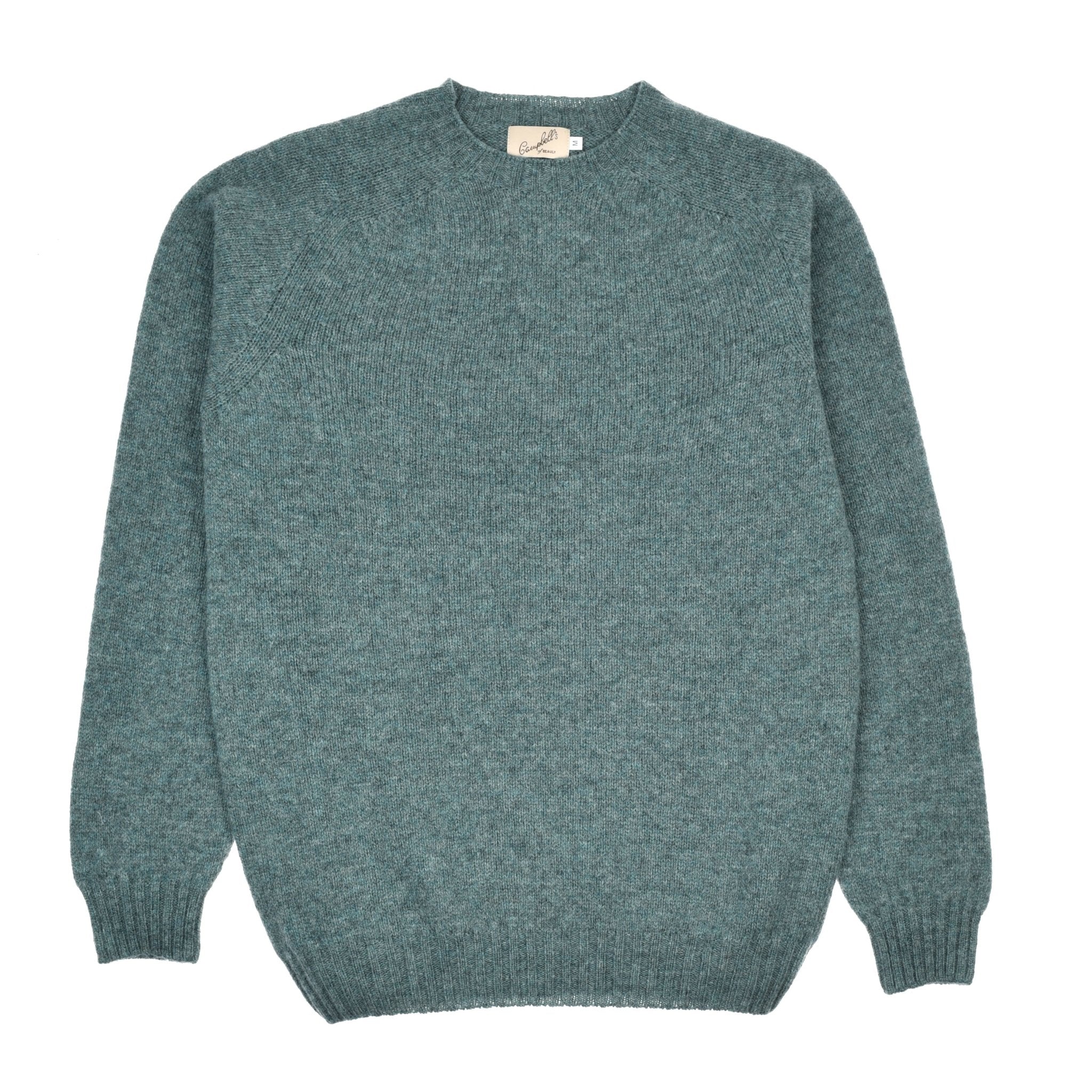 The Campbells of Beauly Shetland Jumper in teal, made from soft lambswool, features long sleeves, a crew neckline, ribbed cuffs and waistband, and is displayed flat on a white background.