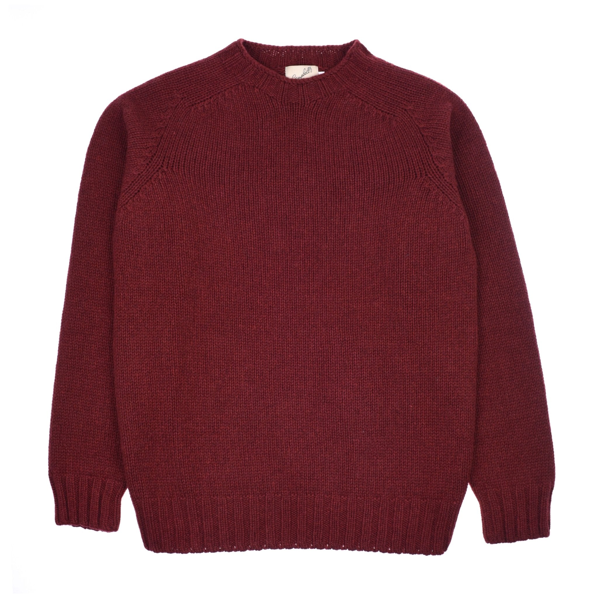 The Campbells of Beauly Geelong Lambswool Chunky Crew Jumper in russet, featuring a plain long-sleeved design, is laid flat on a white background.