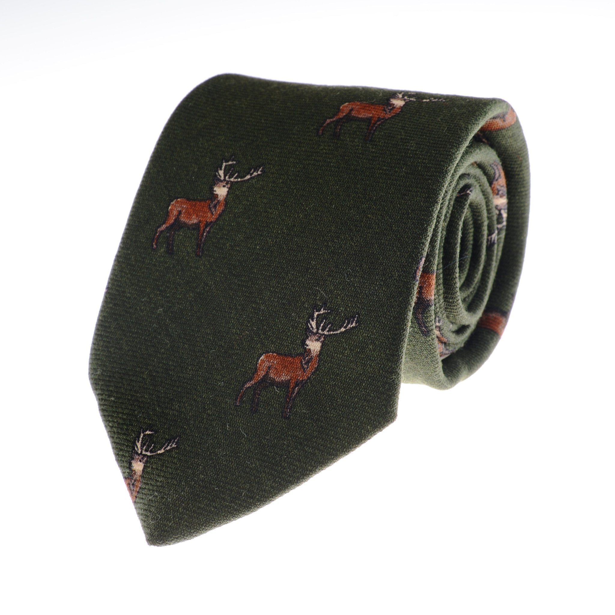 The Campbells of Beauly Stag Silk Tie in green, featuring a repeating brown stag motif with antlers, is elegantly rolled and displayed on a plain white background—ideal for countryside style.