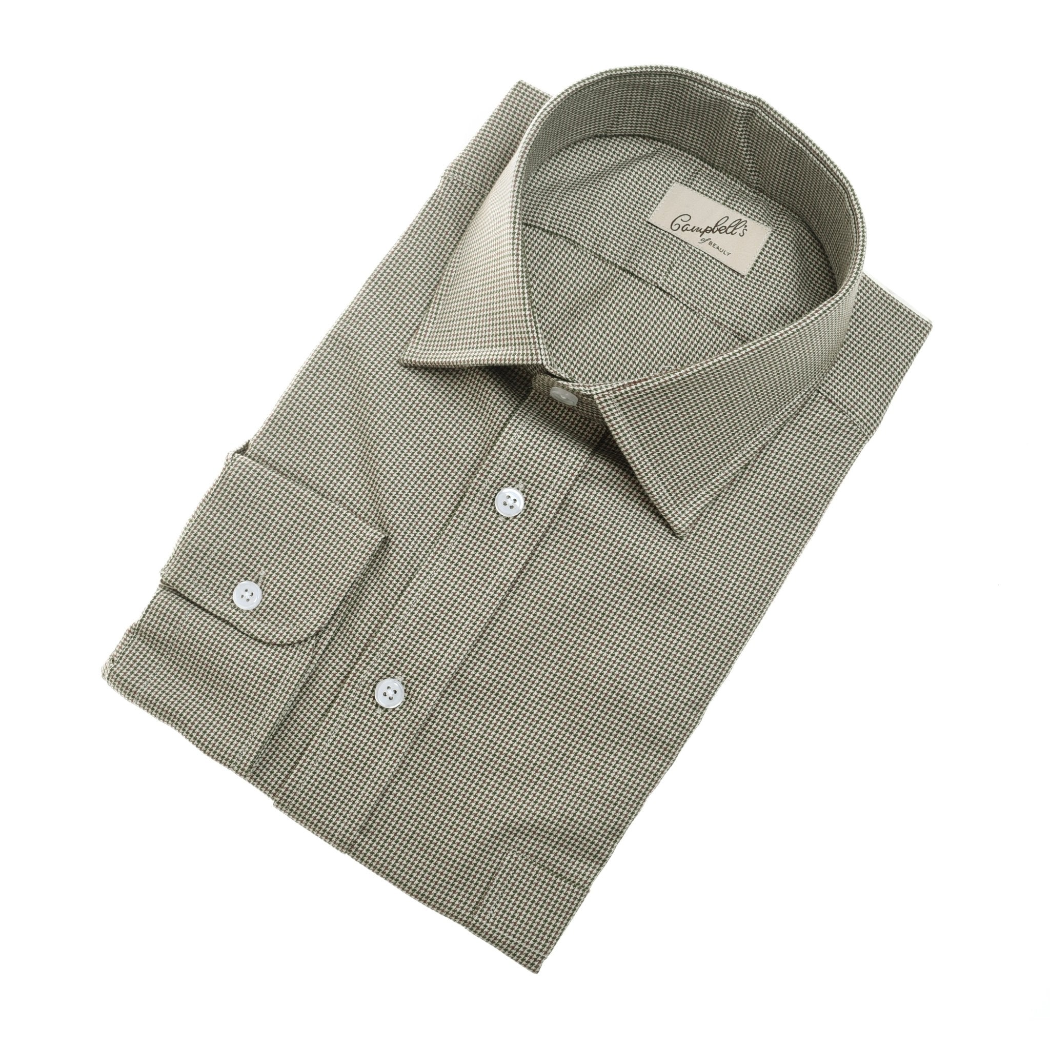 A Campbells of Beauly Grouse Shirt, classic fit and long-sleeve in light brown check brushed cotton with white buttons and a front pocket, is neatly folded and displayed on a white background.