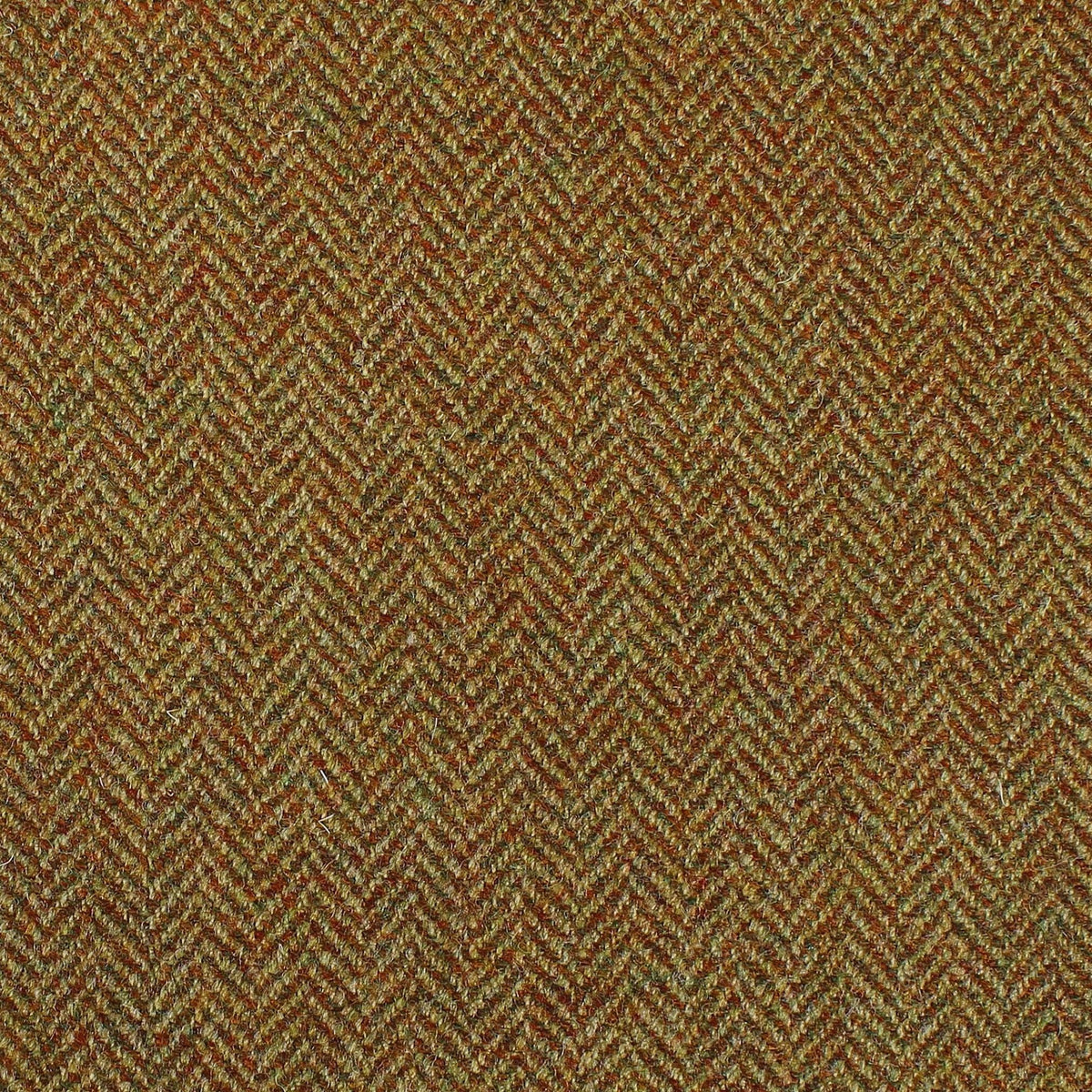 Close-up of Lovat Mill Estate Tweed 079, a brown, orange, and green fabric with a classic herringbone weave.