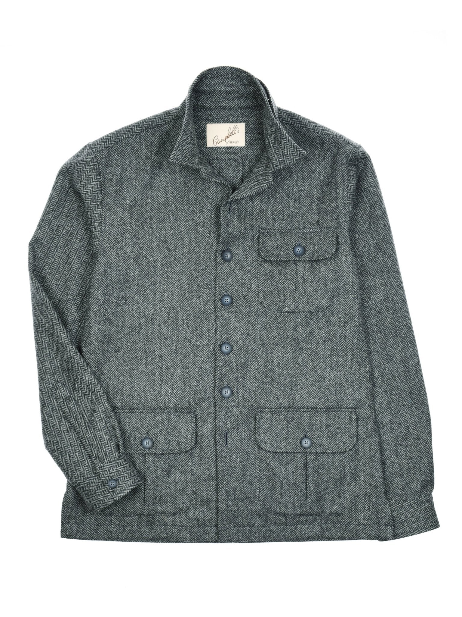 The Campbells of Beauly Casual Shacket is a gray, textured jacket with a collar, four buttoned front pockets, and a visible inner label. Inspired by traditional tailoring, it offers a relaxed fit for everyday wear.