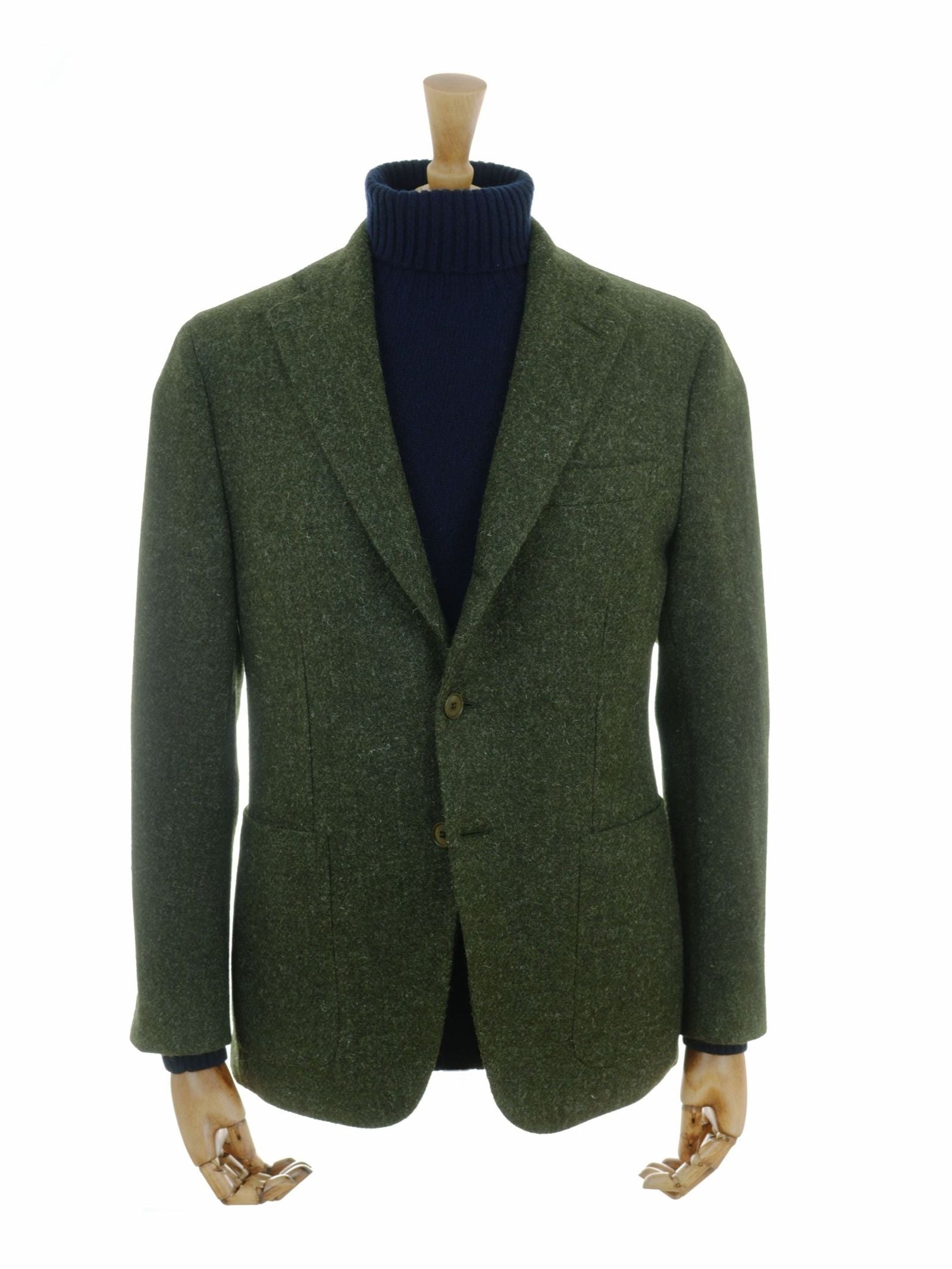 A mannequin displays the Campbell’s of Beauly Harris Tweed Jacket in dark green, featuring a regular fit, layered over a navy turtleneck sweater against a plain white background.