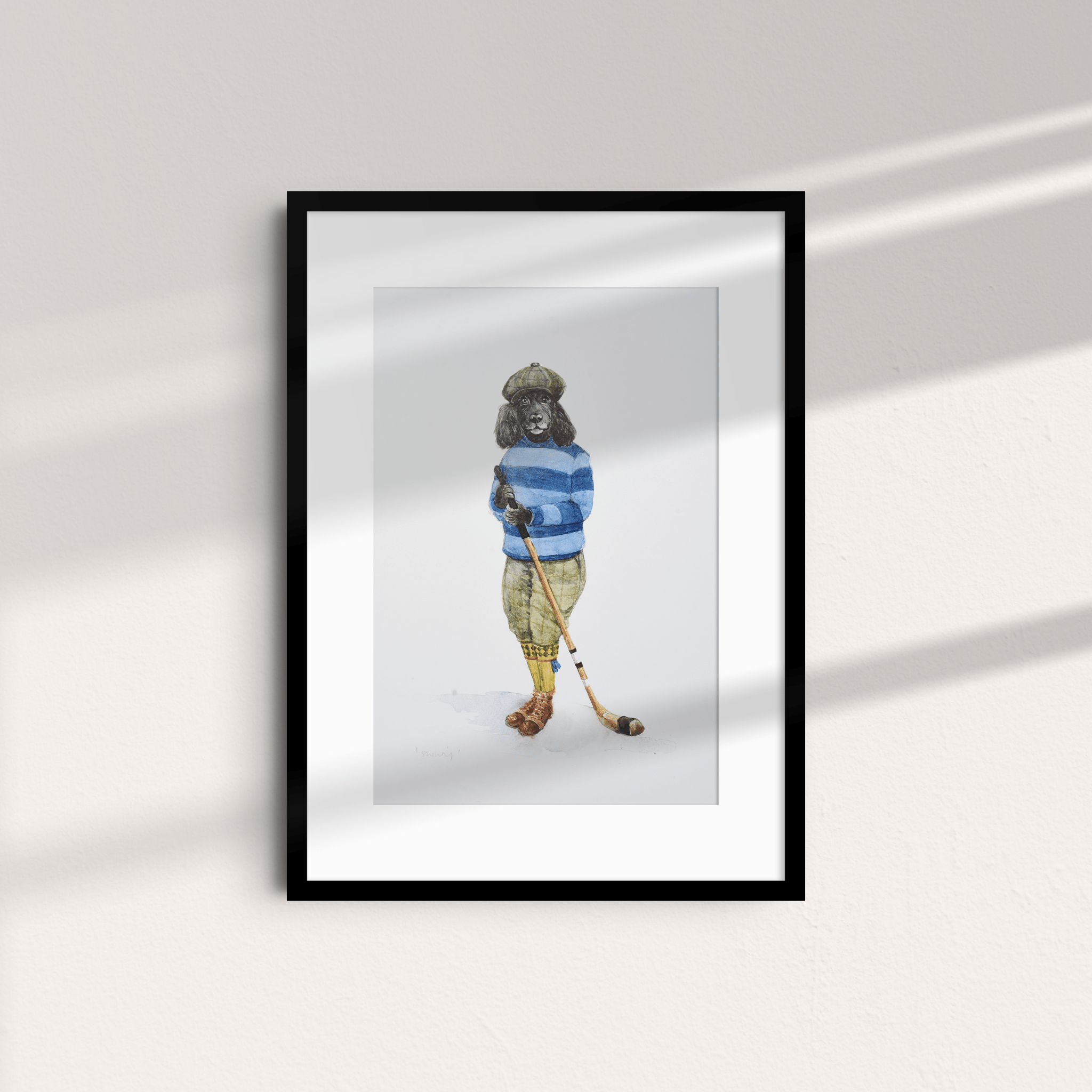 The Shinty Player Unframed Print by Campbell's of Beauly features a dog in vintage golf attire—green cap, blue striped sweater, yellow pants, and brown shoes—holding a golf club against a light wall with sunlight casting shadows.