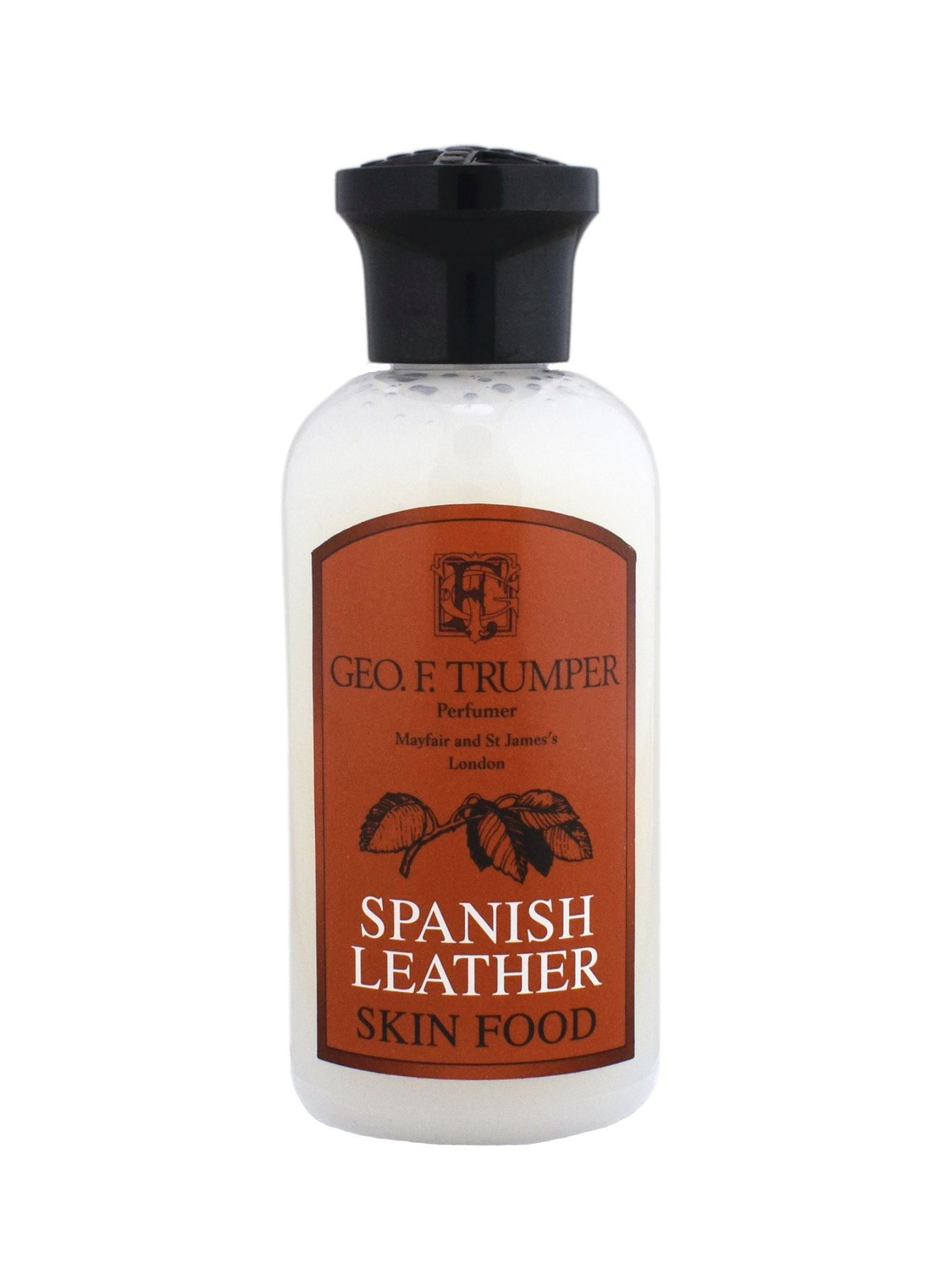 A bottle of Geo. F. Trumper Spanish Leather Skin Food, with a black cap and brown label featuring a leaf design—an essential for any gentleman’s grooming routine.