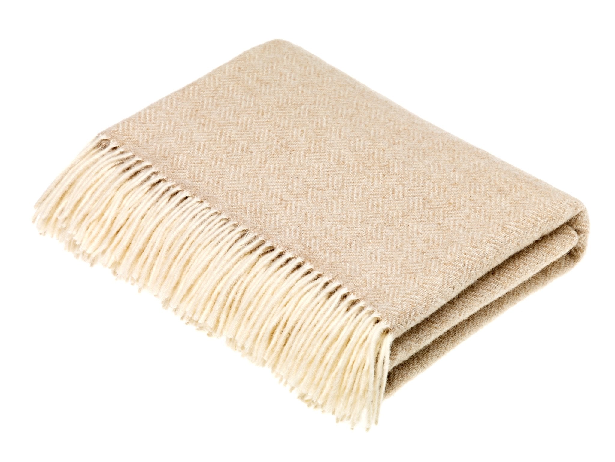 The Campbells of Beauly Parquet Lambswool Blanket in cream features a subtle parquet weave and fringe on one edge, displayed folded against a white background.