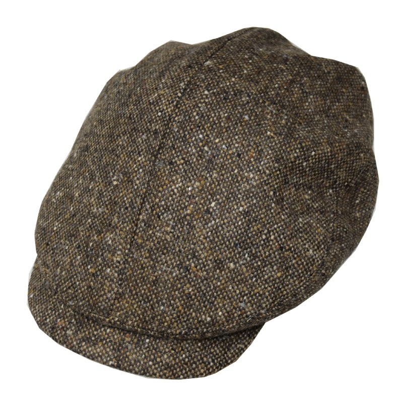The Campbells of Beauly Affric Cap in Brown Donegal features a subtle checkered pattern, a curved brim, and classic vintage style.