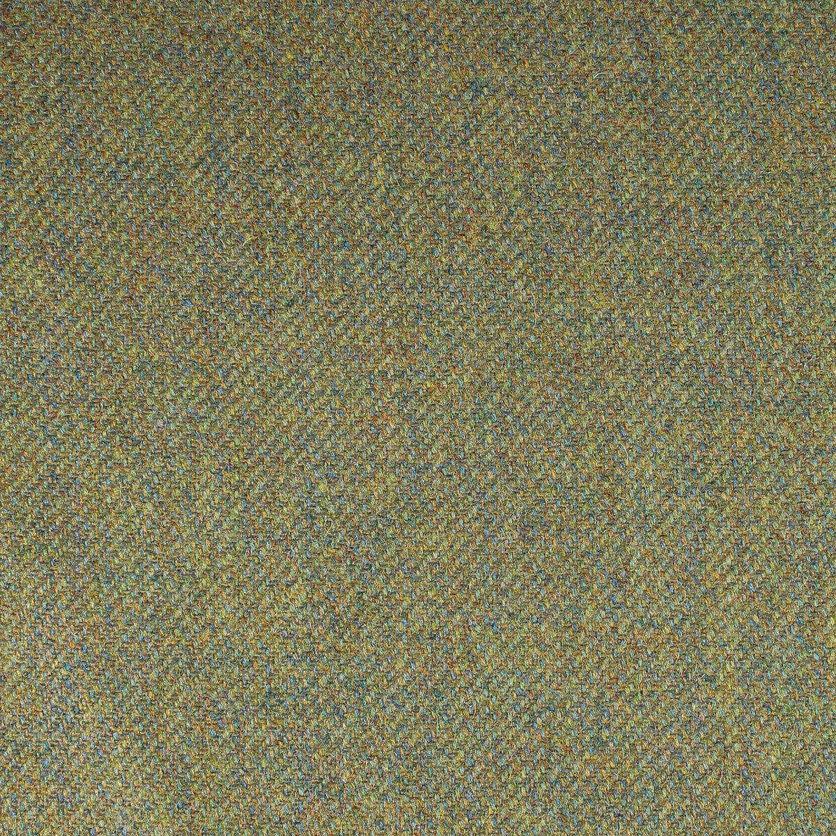 Close-up of the Field Tweed 127, a green and brown Scottish tweed in a herringbone weave with flecks of blue.