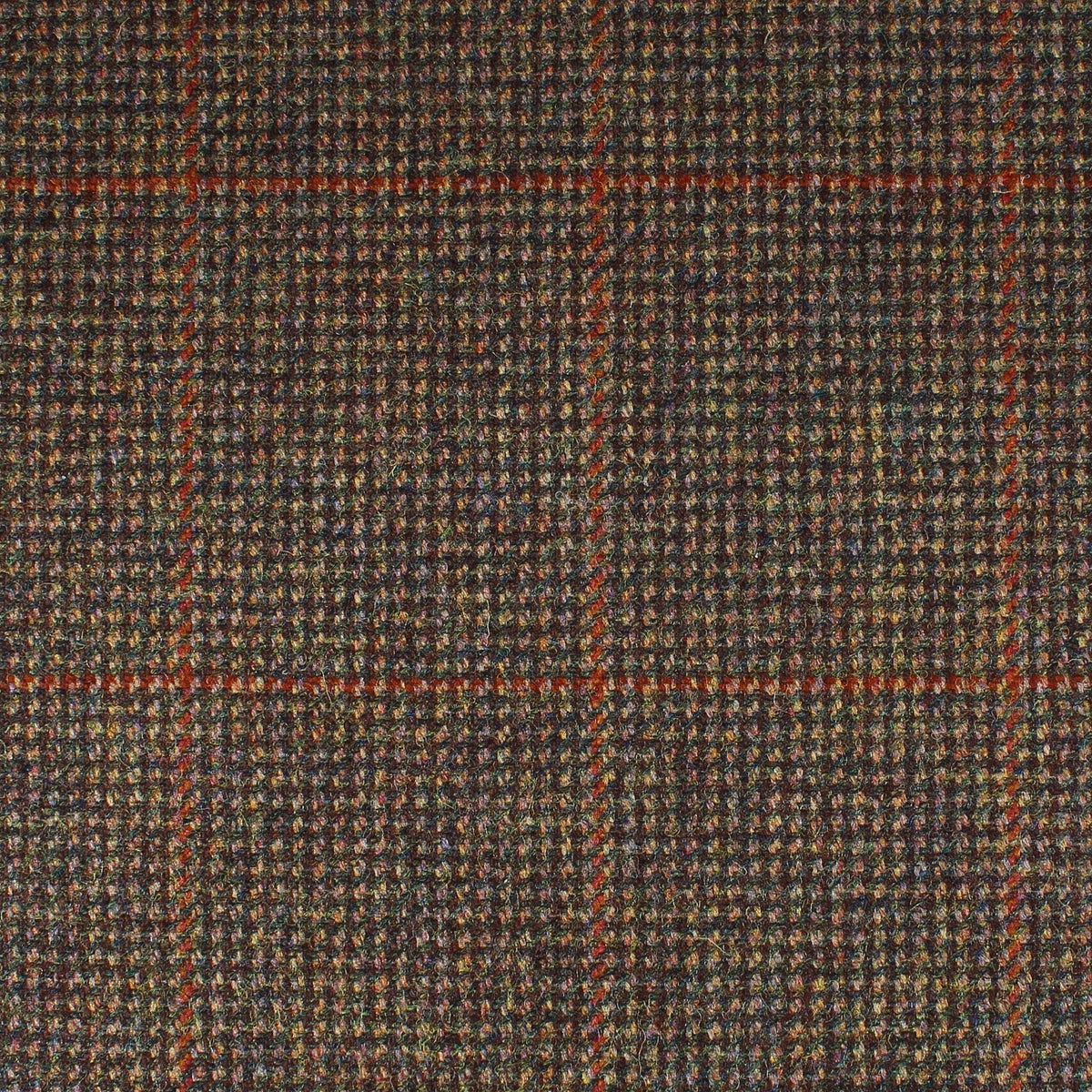 Field Tweed 133 is a dark brown Scottish tweed with a multicolored flecked texture and a rust-orange windowpane check pattern.