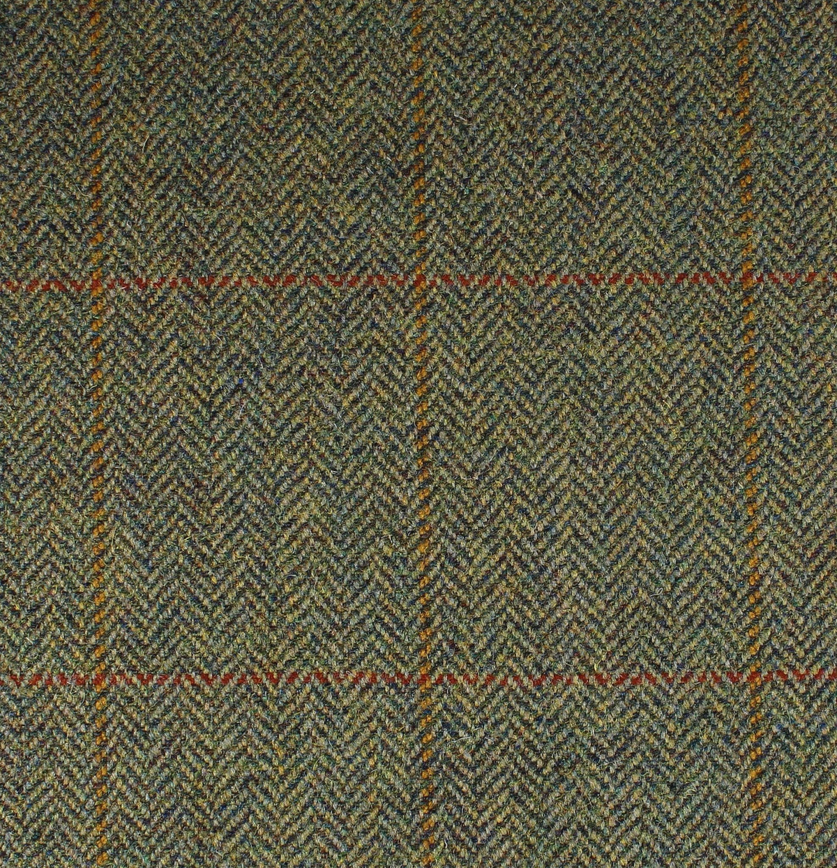The Field Tweed 139 by Lovat Mill is a classic green and brown herringbone Scottish tweed with an orange and red windowpane check—100% wool, perfect for timeless country clothing.