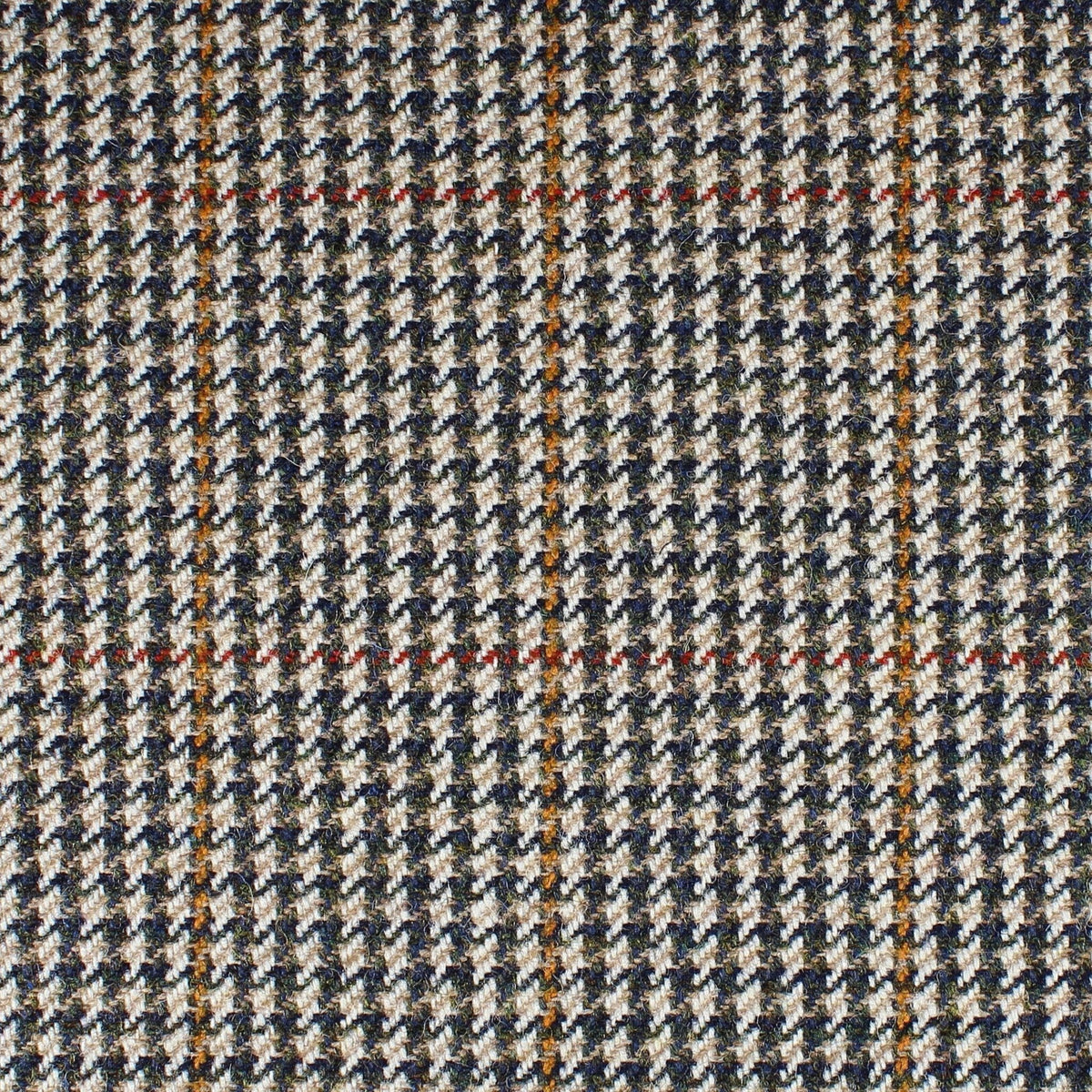 Field Tweed 142 Scottish 100% wool tweed in a houndstooth pattern of tan, brown, and navy with a faint orange and red windowpane check.