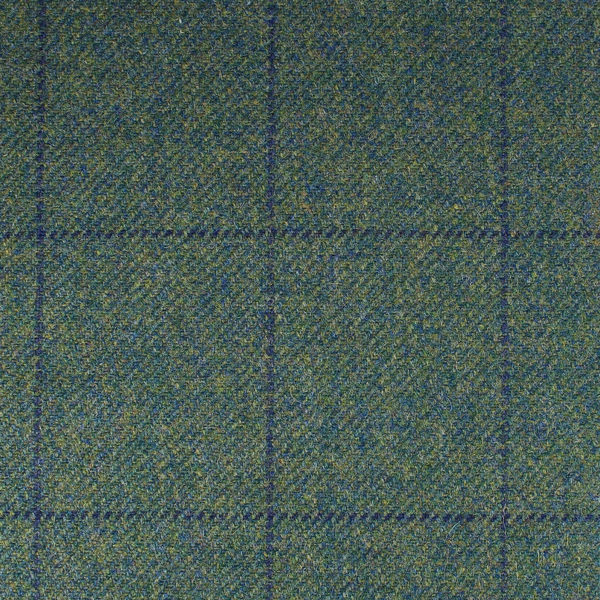 Field Tweed 143 Scottish tweed fabric in green and blue herringbone with a dark blue windowpane check pattern.