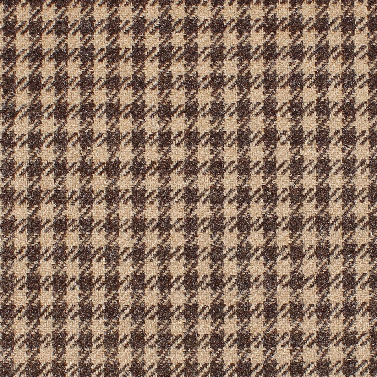 Close-up of Campbell’s of Beauly House Tweed 95035 fabric, featuring a brown and beige houndstooth pattern with small, repeating geometric shapes.