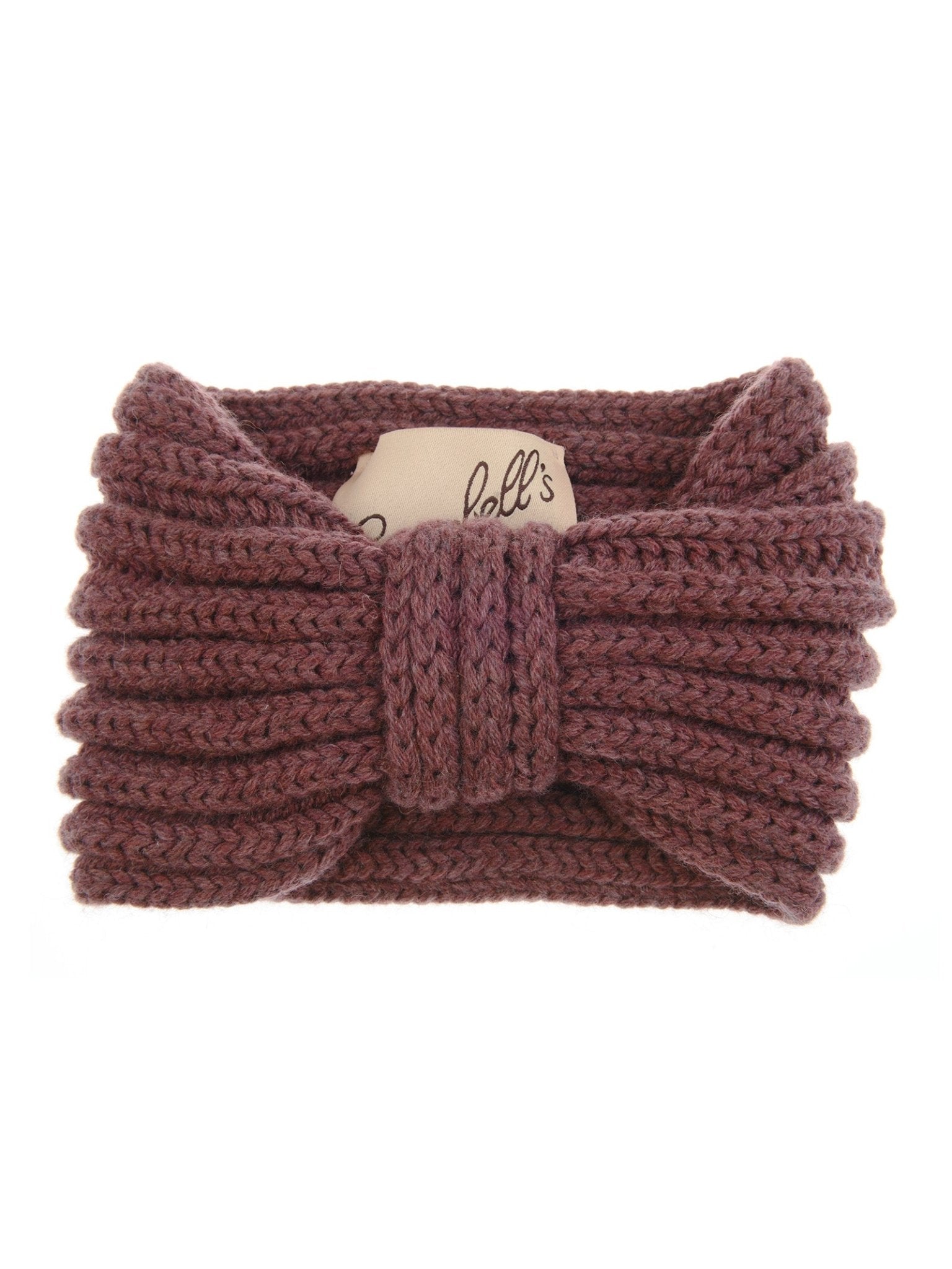 The Campbell's of Beauly Cashmere Ear Warmer in Dusty Rose is pictured folded, highlighting its large ribbed knit bow and a partially visible fabric label inside this cozy winter accessory.