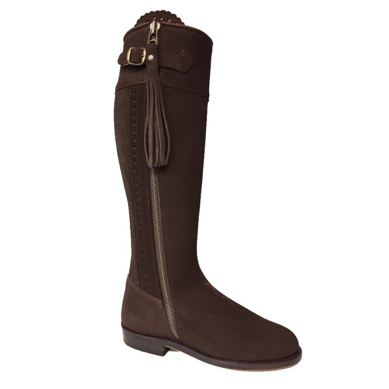 The Suede Spanish Boots by Campbells of Beauly are tall, brown boots featuring a side zipper, decorative tassel, top buckle detail, low heel, leather-lined interior, and a smooth suede finish—offering classic country style.