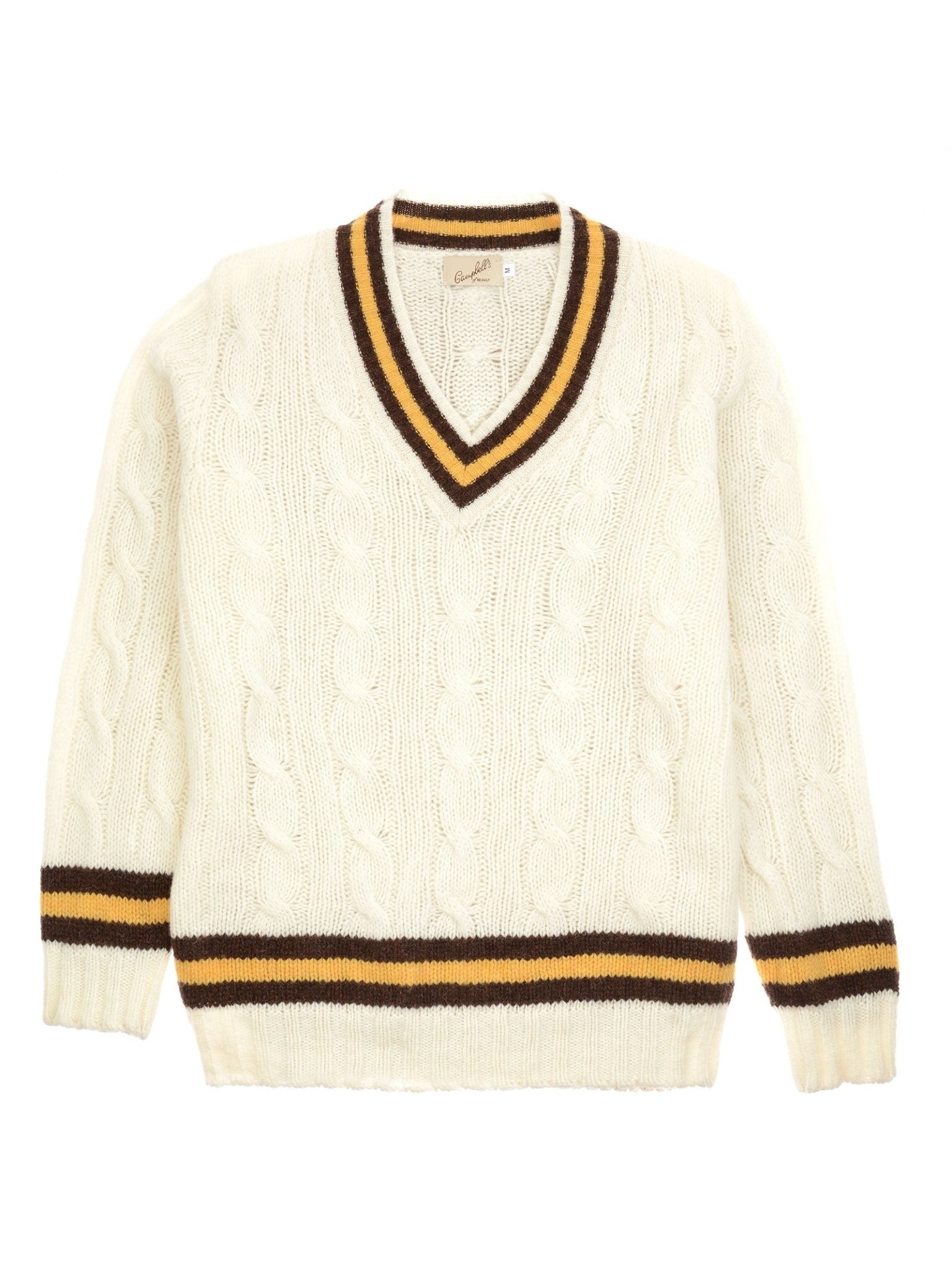 The Shetland Cricket Sweater by Campbell's of Beauly features a cream cable-knit design with a V-neckline and ribbed cuffs, collar, and hem accented by classic brown and gold cricket stripes.